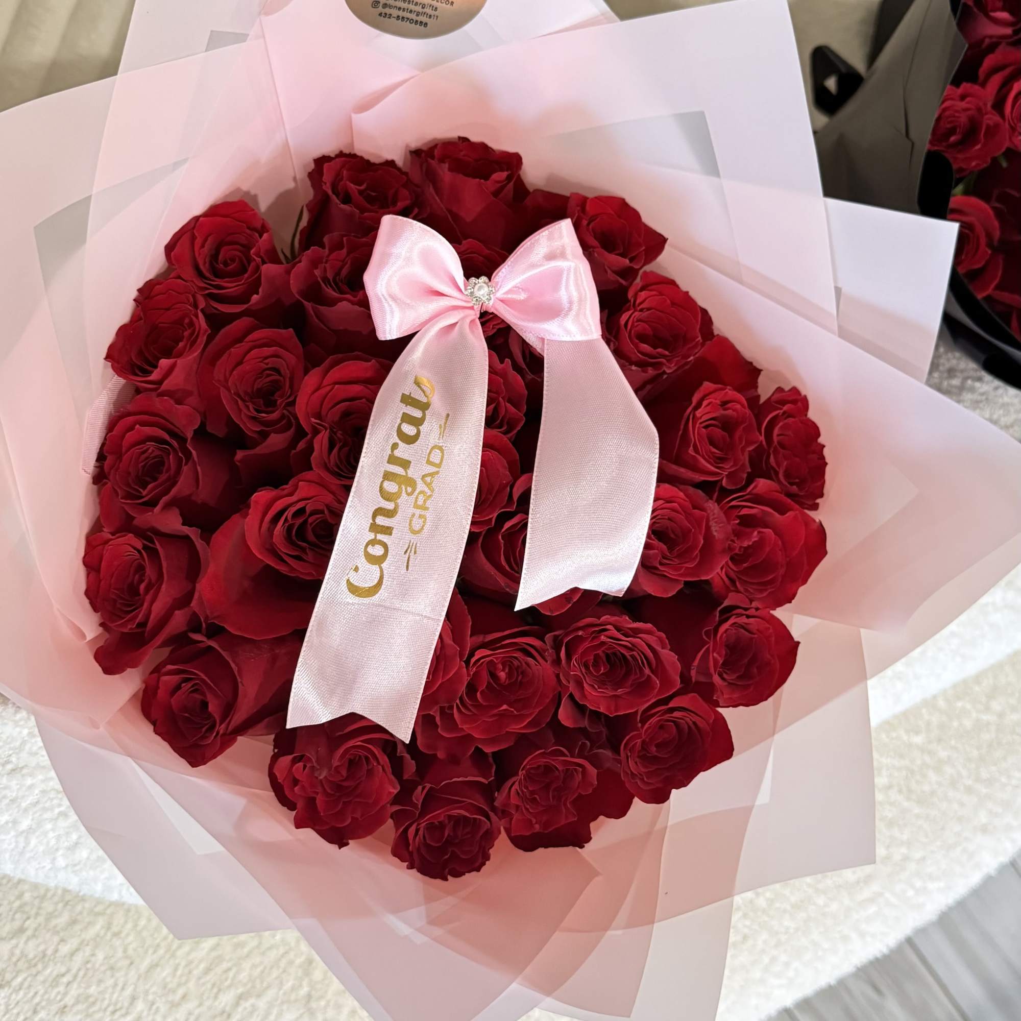 Celebrate their big achievement with a timeless Graduation Bouquet featuring two dozen
