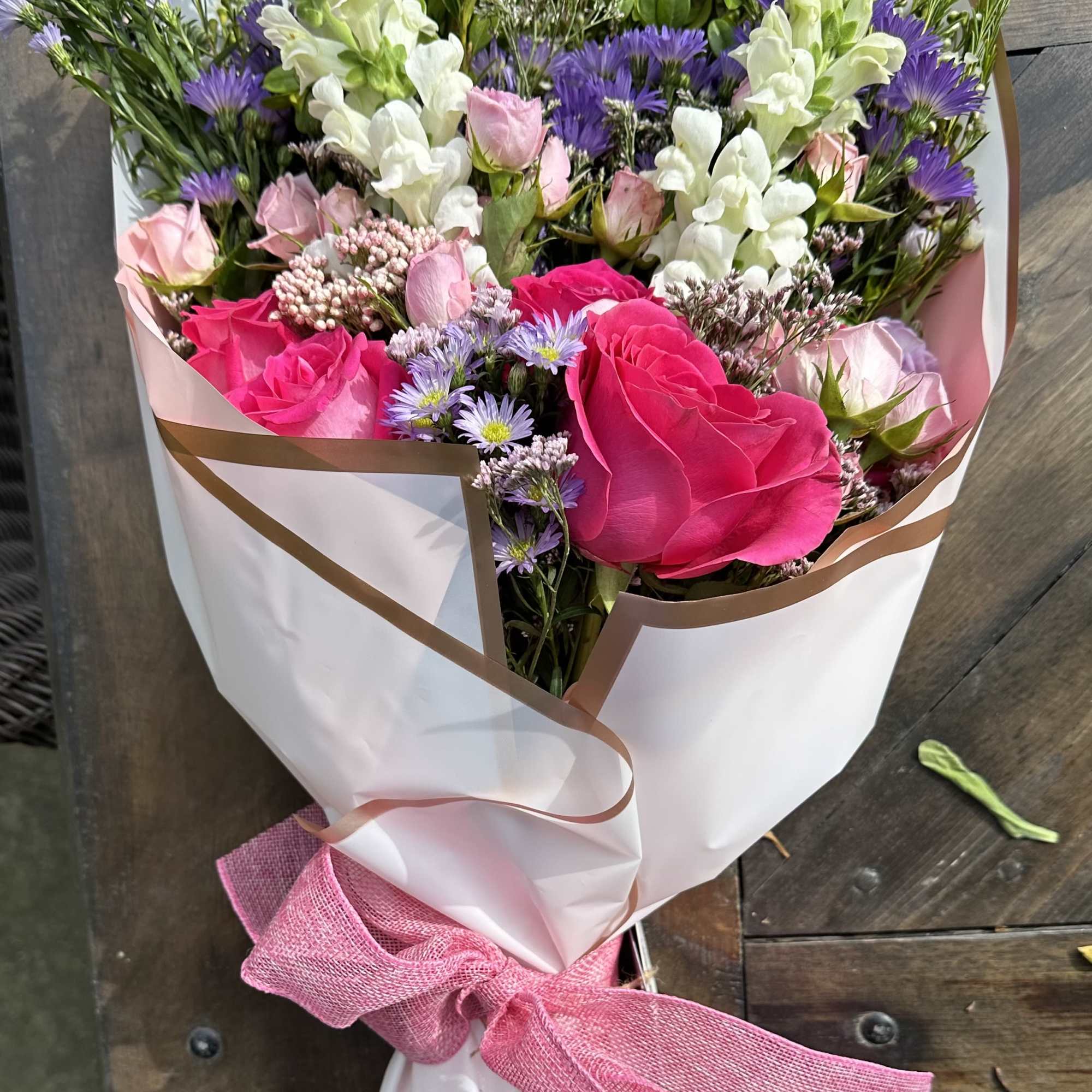 A gorgeous large bouquet of seasonal blooms filled with a variety of