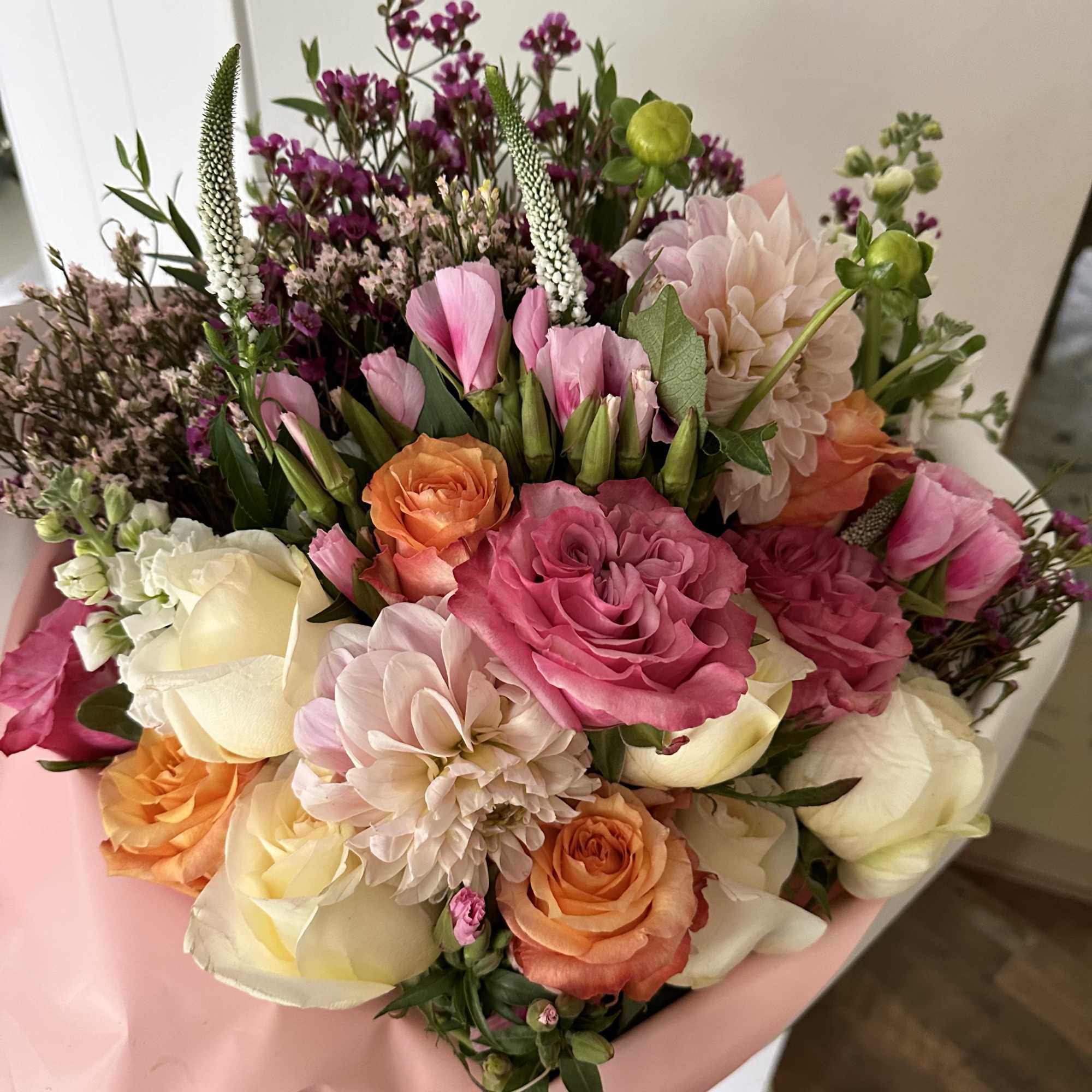 A gorgeous large bouquet of seasonal blooms filled with a variety of