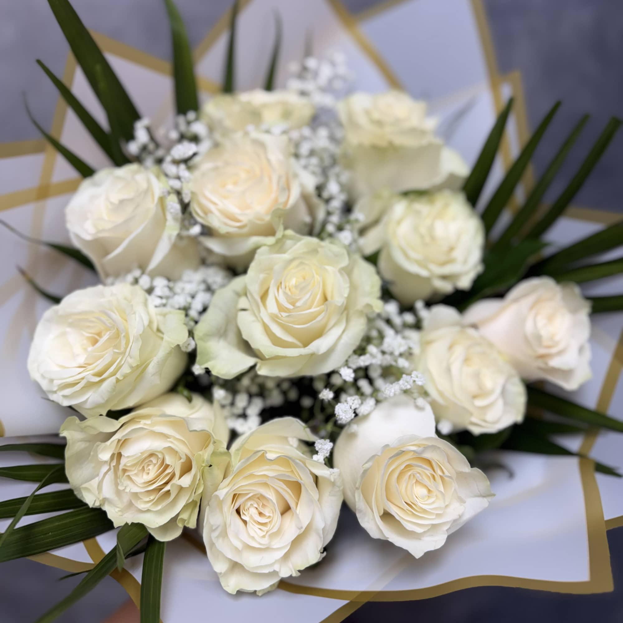 Introducing our white roses bouquet, beautifully made with white roses, baby's breath