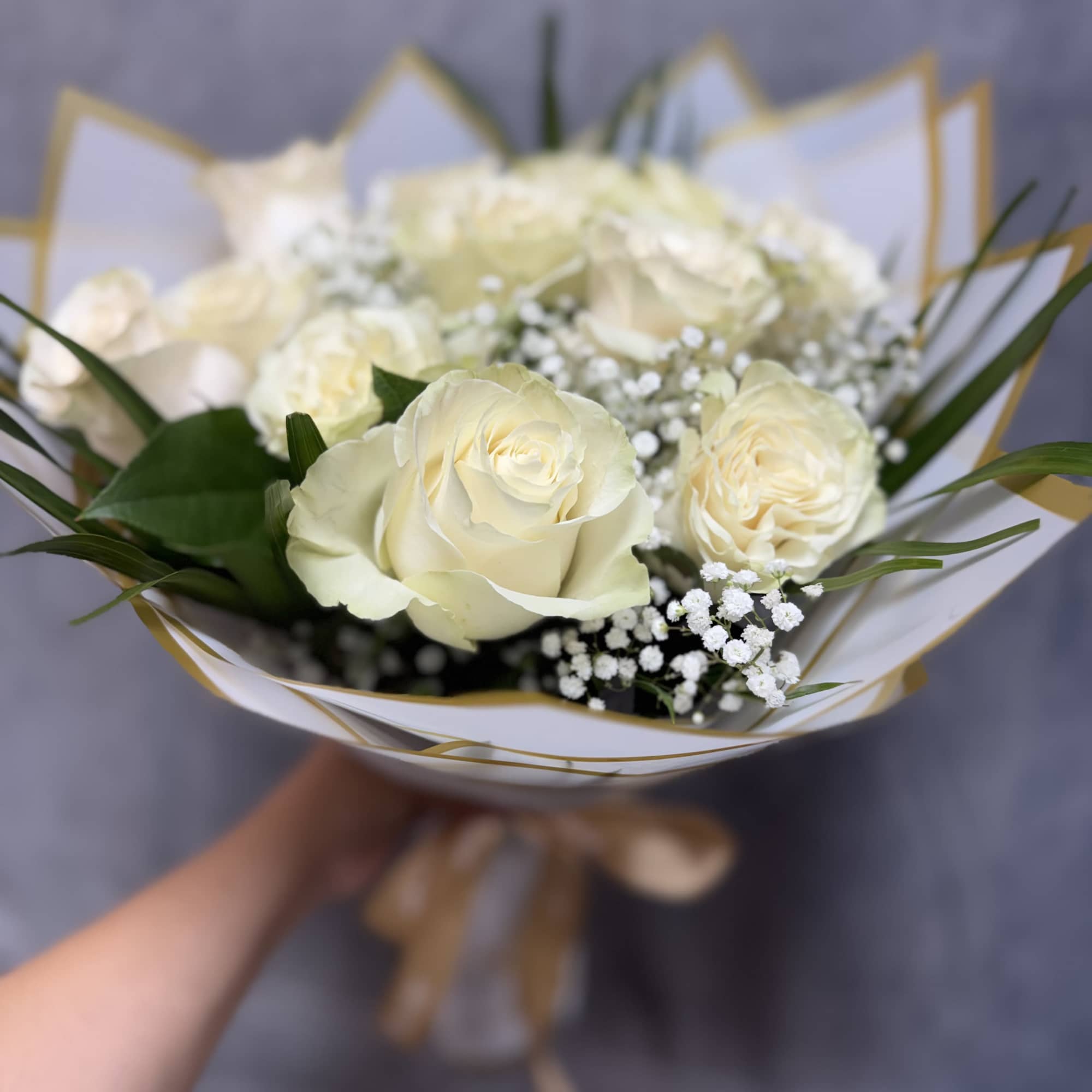 Introducing our white roses bouquet, beautifully made with white roses, baby's breath