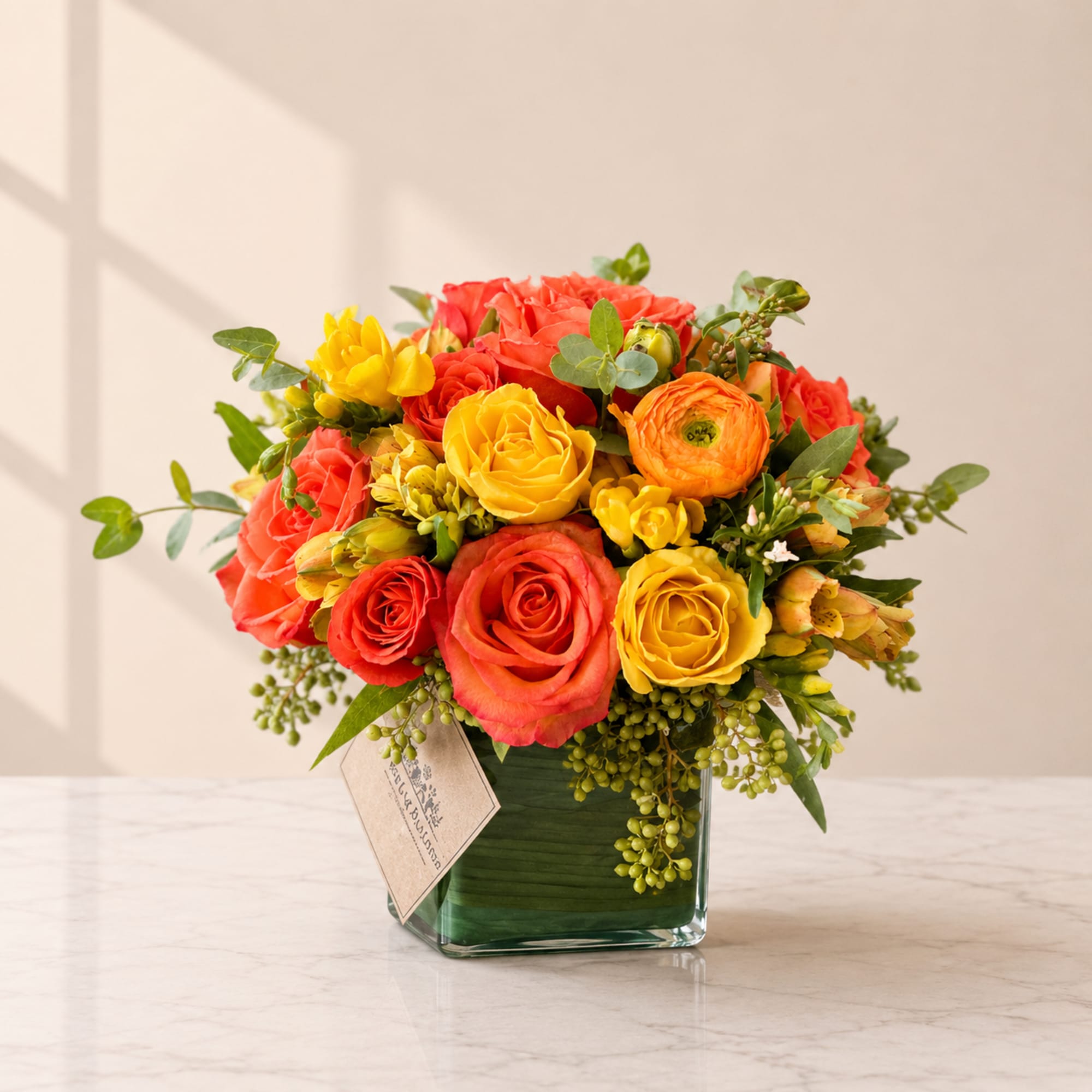 Brighten their day with our Sun Kiss Arrangement, a stunning mix of