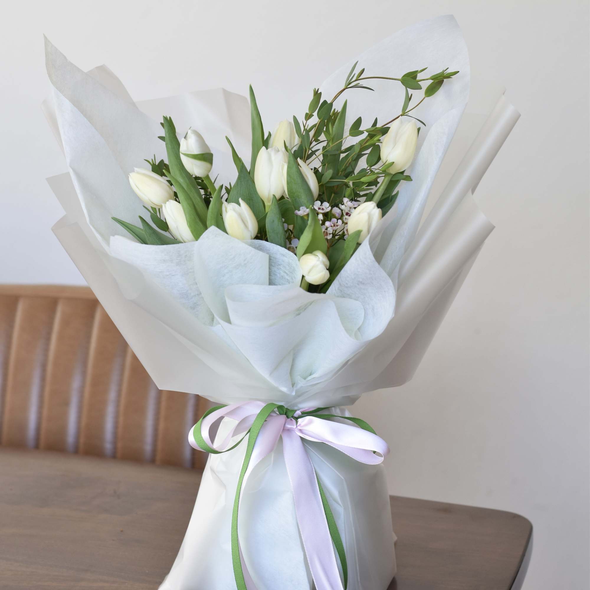 A tulip bouquet is a vibrant and enchanting arrangement of tulip flowers