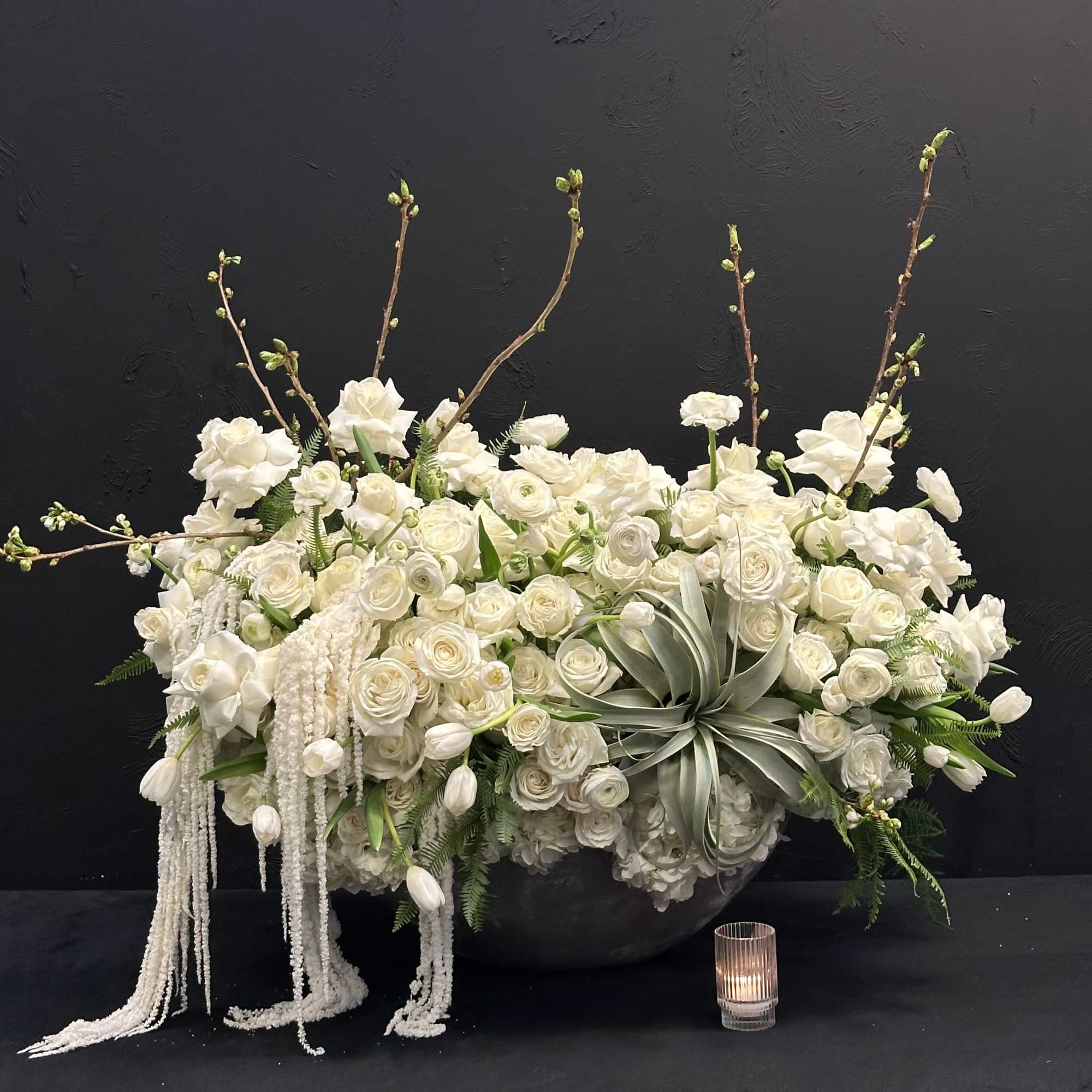 White Elegance boasts a captivating blend of Blossoms, White Tulips, Roses, Ranunculus
