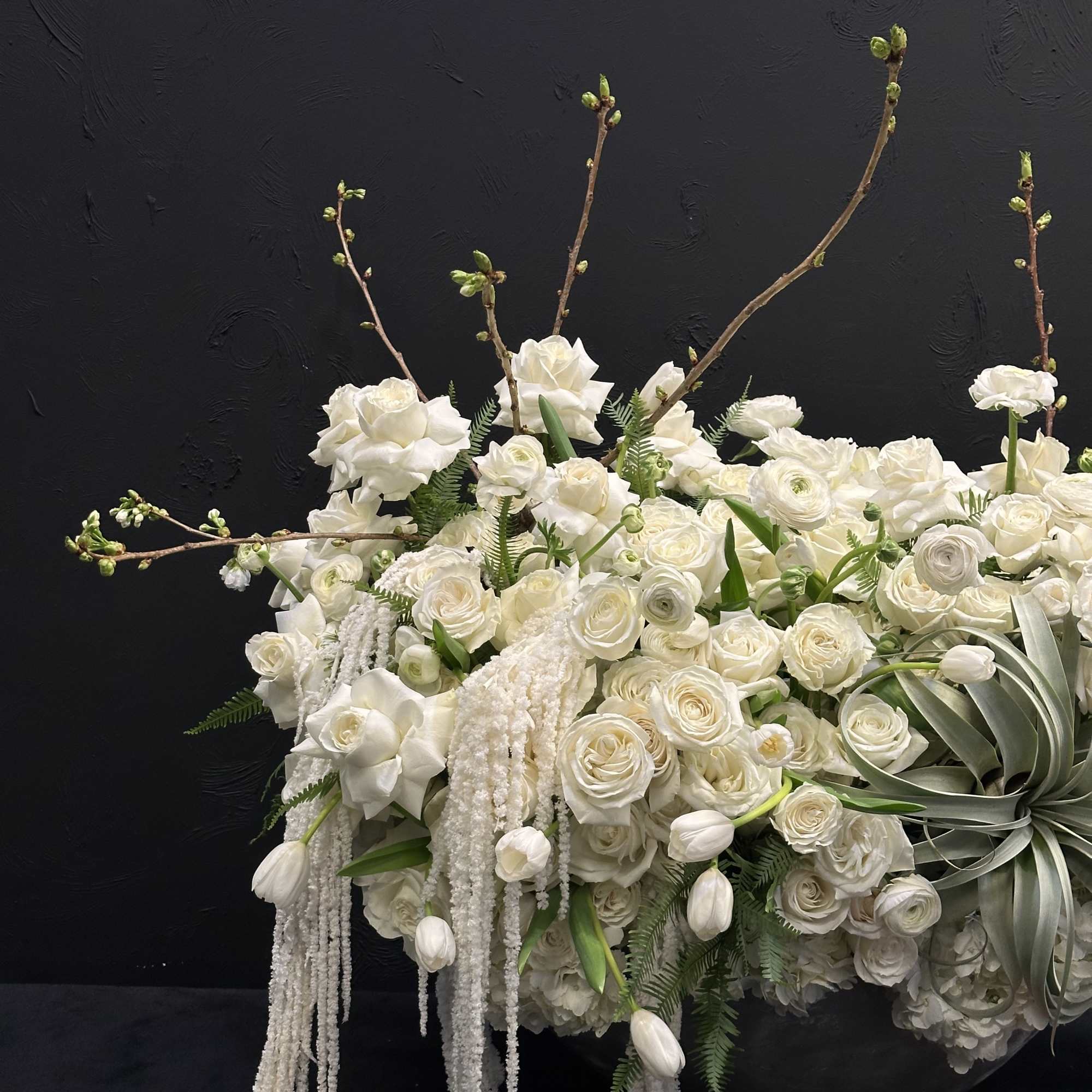 White Elegance boasts a captivating blend of Blossoms, White Tulips, Roses, Ranunculus