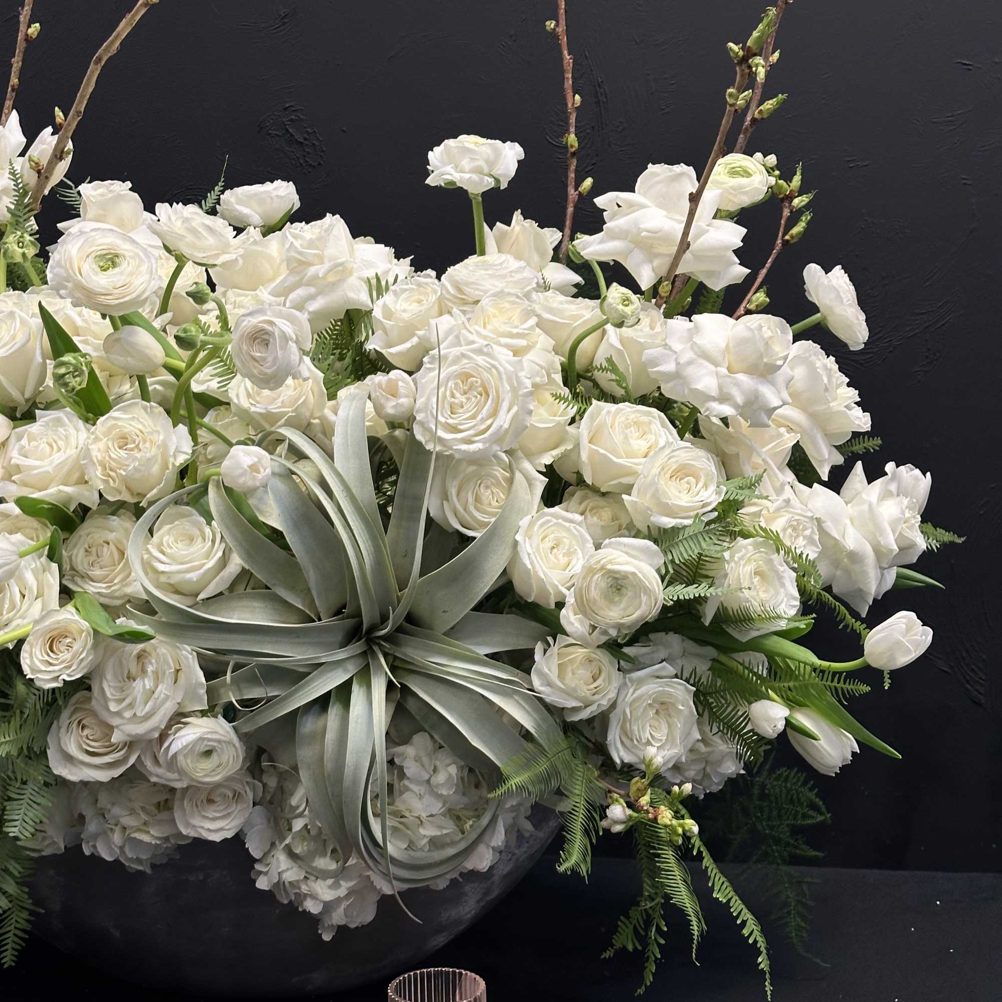 White Elegance boasts a captivating blend of Blossoms, White Tulips, Roses, Ranunculus