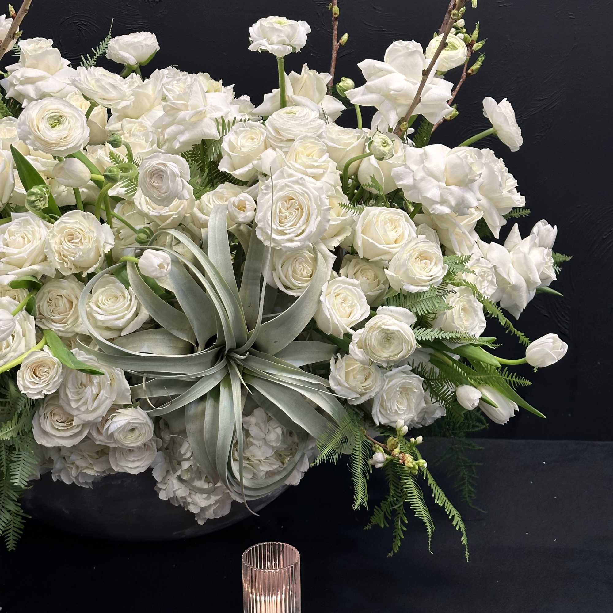 White Elegance boasts a captivating blend of Blossoms, White Tulips, Roses, Ranunculus