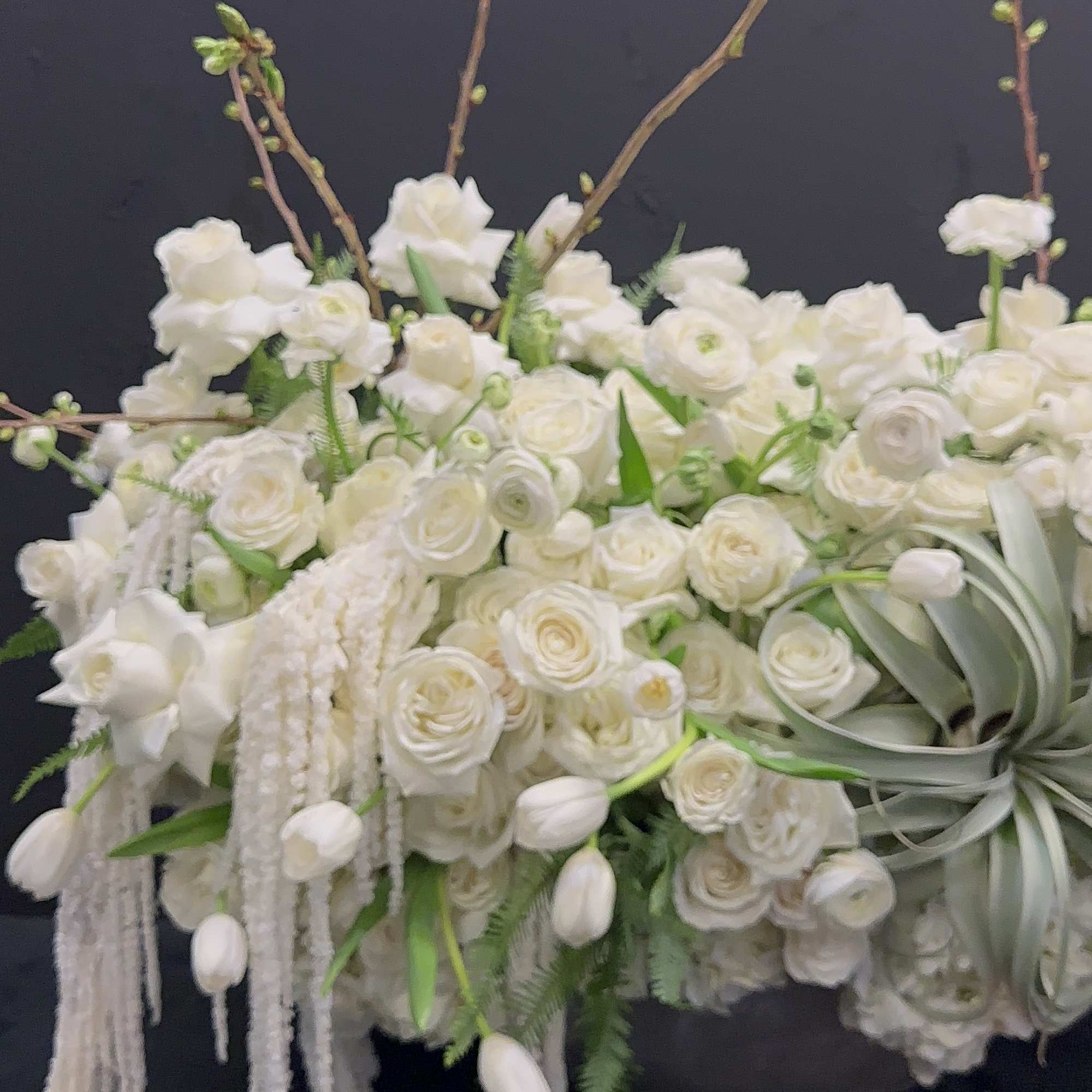 White Elegance boasts a captivating blend of Blossoms, White Tulips, Roses, Ranunculus