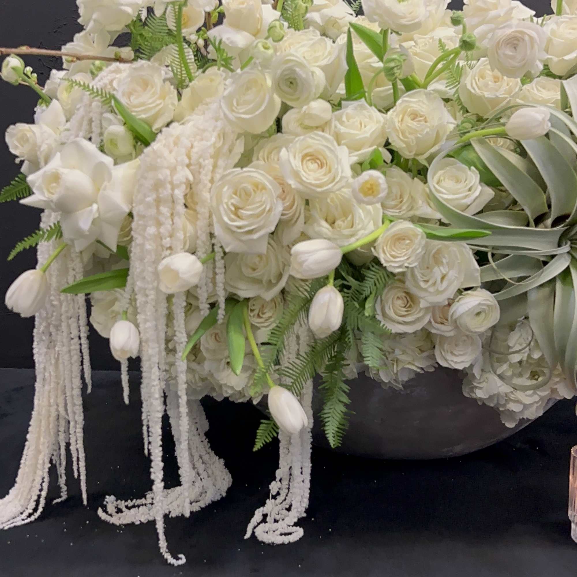 White Elegance boasts a captivating blend of Blossoms, White Tulips, Roses, Ranunculus
