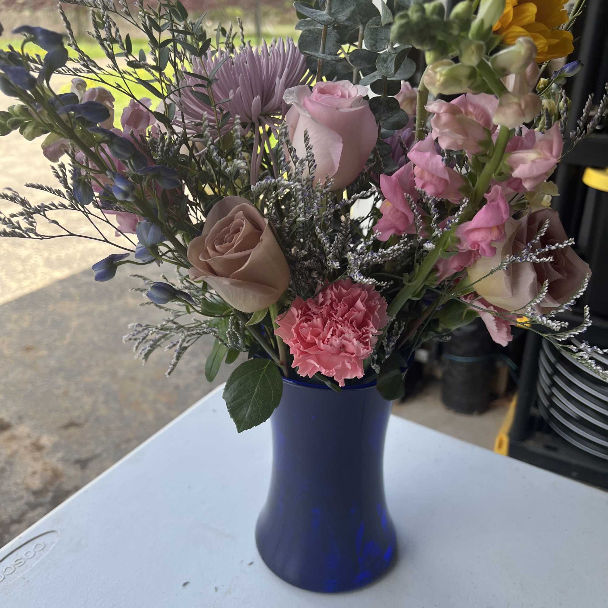 A lively, garden-style flower arrangement that sings of spring-perfect as a birthday