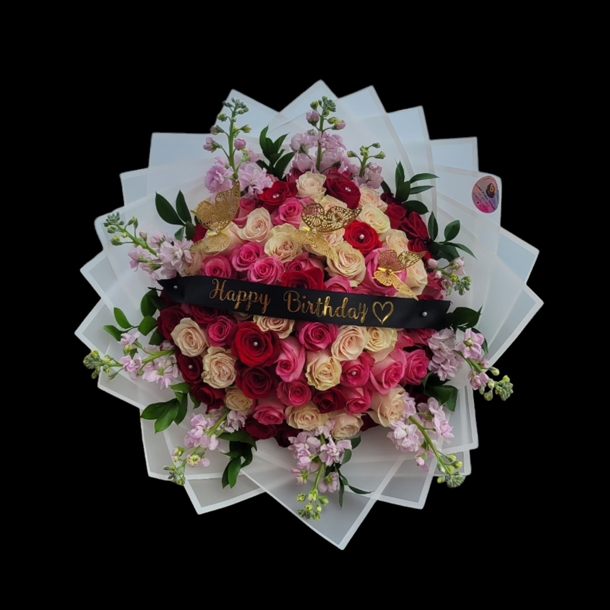 Bouquet of pink and red roses with a Happy Birthday sign