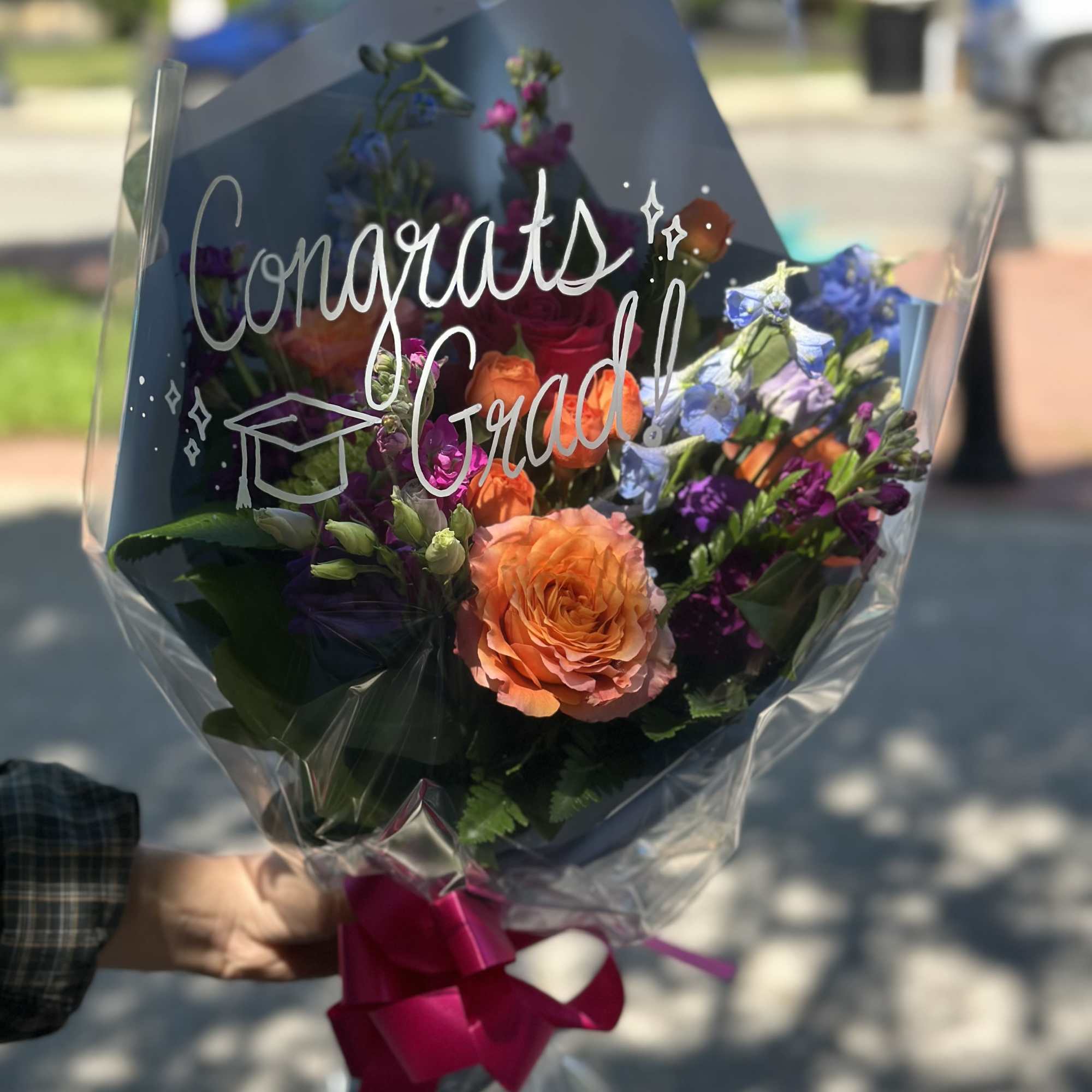 Beautiful fresh presentation bouquet for your special graduate! We add special touch