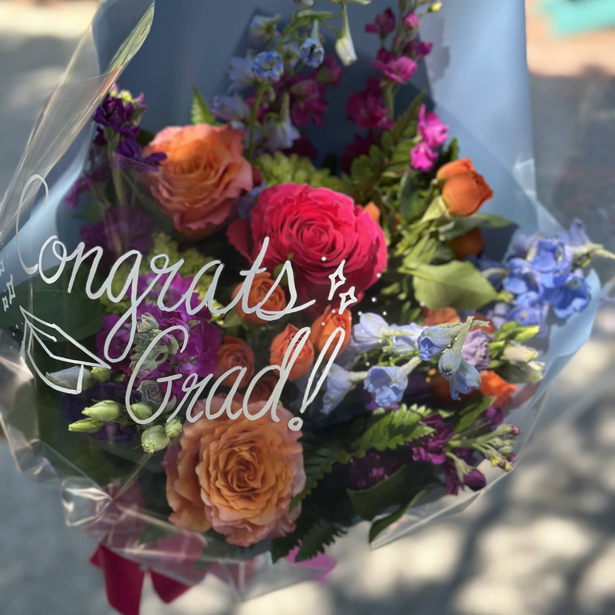 Beautiful fresh presentation bouquet for your special graduate! We add special touch