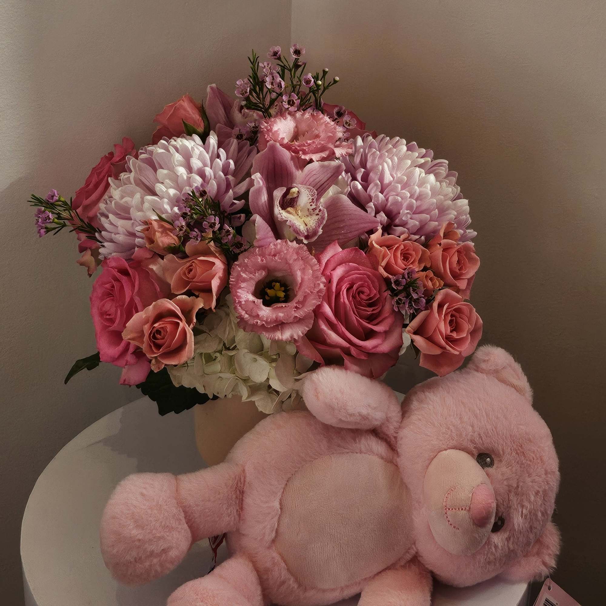Pink bouquet with roses, chrysanthemums, and a teddy bear