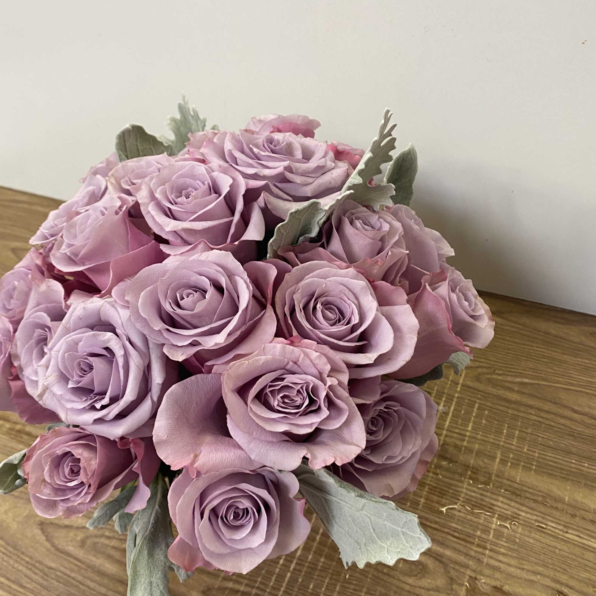 Bouquet of lavender roses with silvery foliage