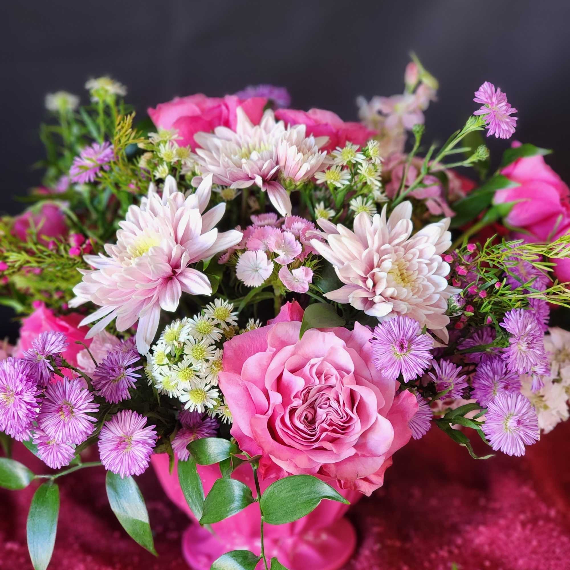 Pink rose bouquet with pale chrysanthemums and purple daisies