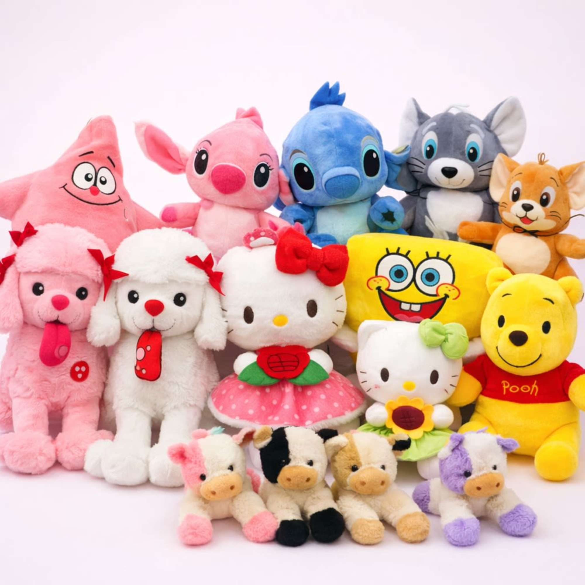 Assorted colorful plush toys arranged in rows on a white background.