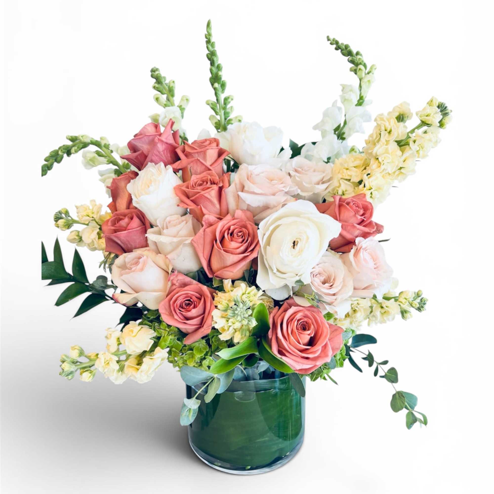 Quiet Grace features premium roses and seasonal blooms in soft blush, ivory