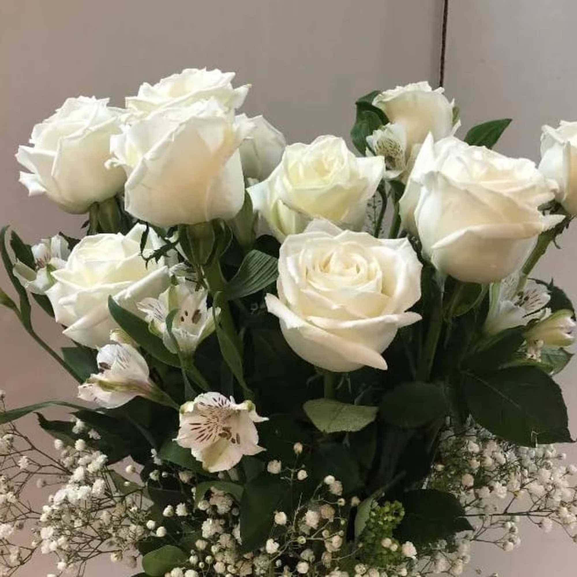 Bouquet of white roses with small white filler flowers