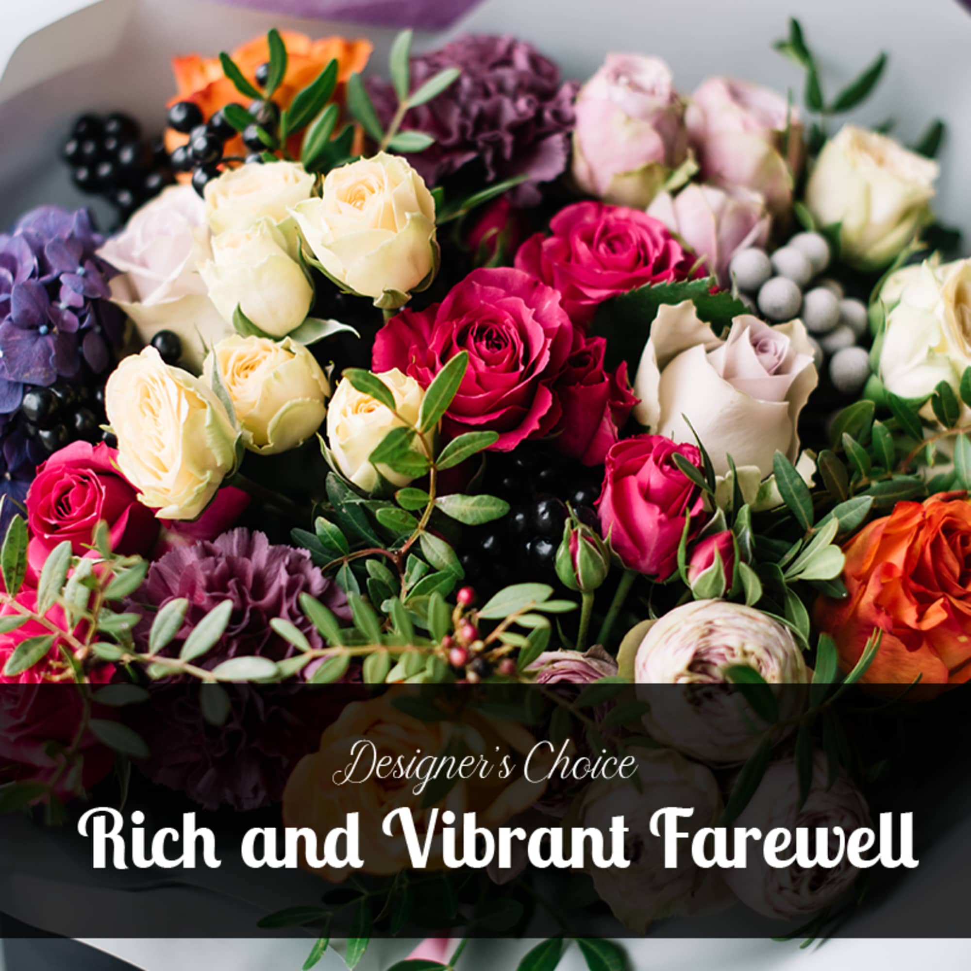 Mixed bouquet of roses in pink, cream, orange, and purple