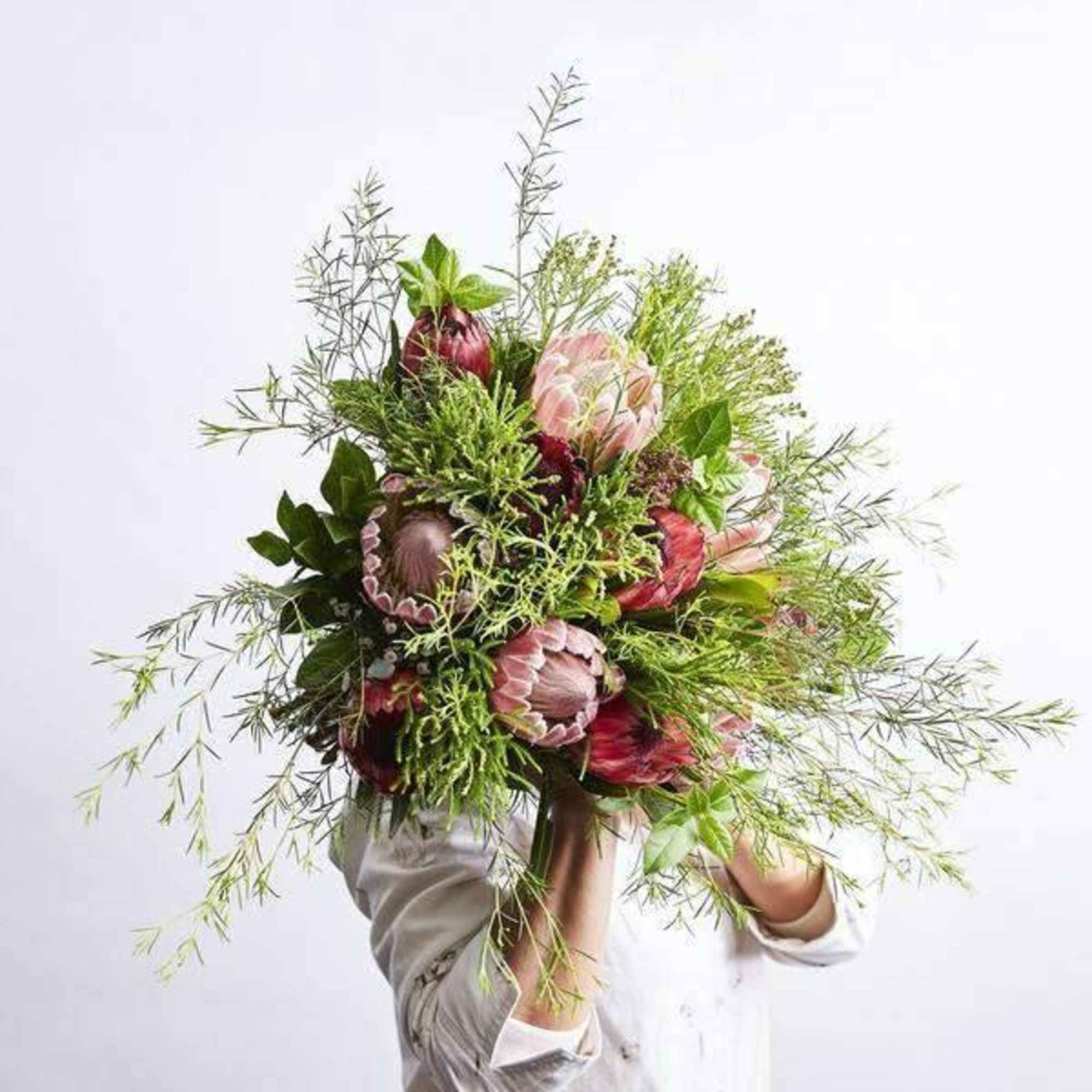 This impressive  mix of tropical florals and exotic greenery  This