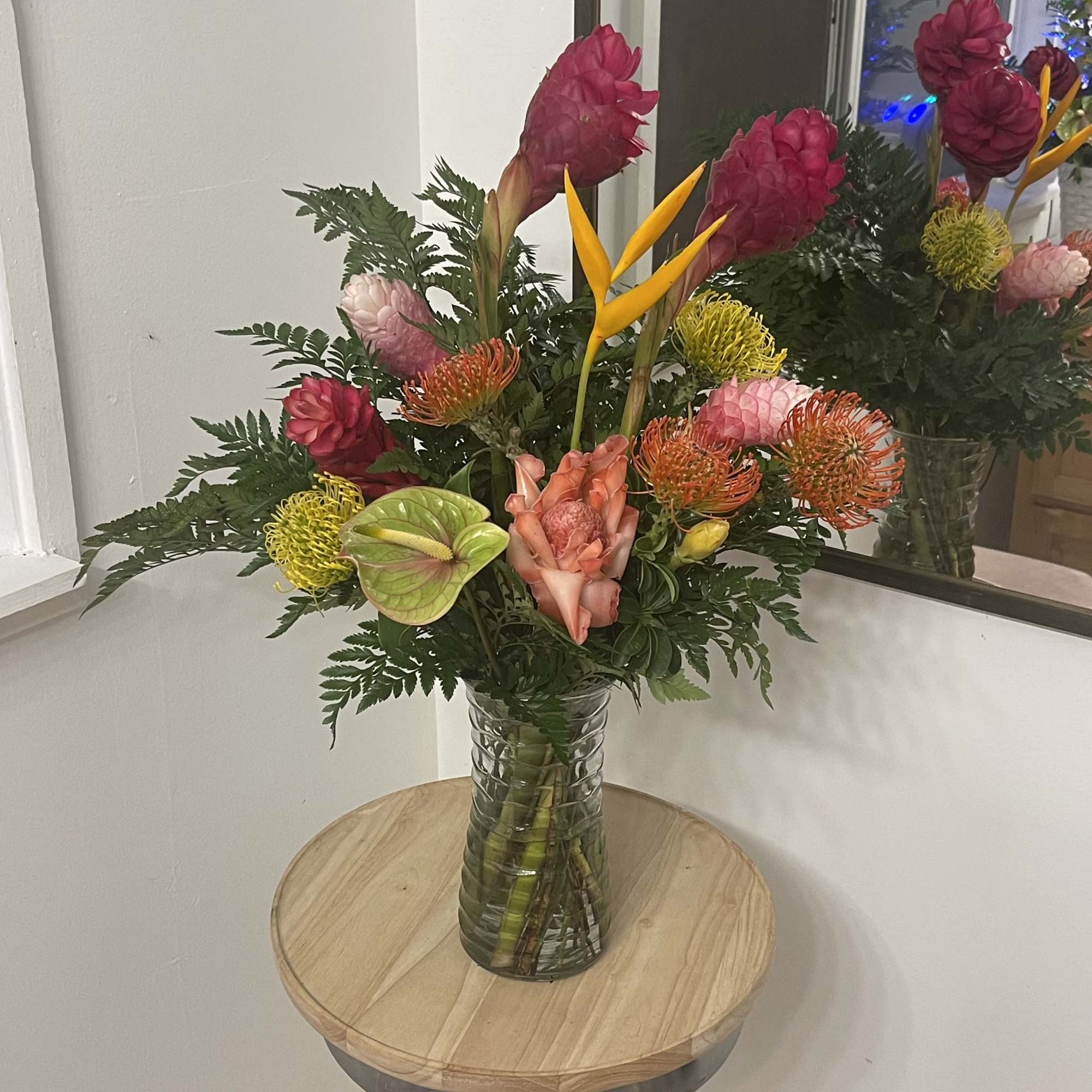 Exotic selection of Tropical Florals in a vase  this floral arrangement