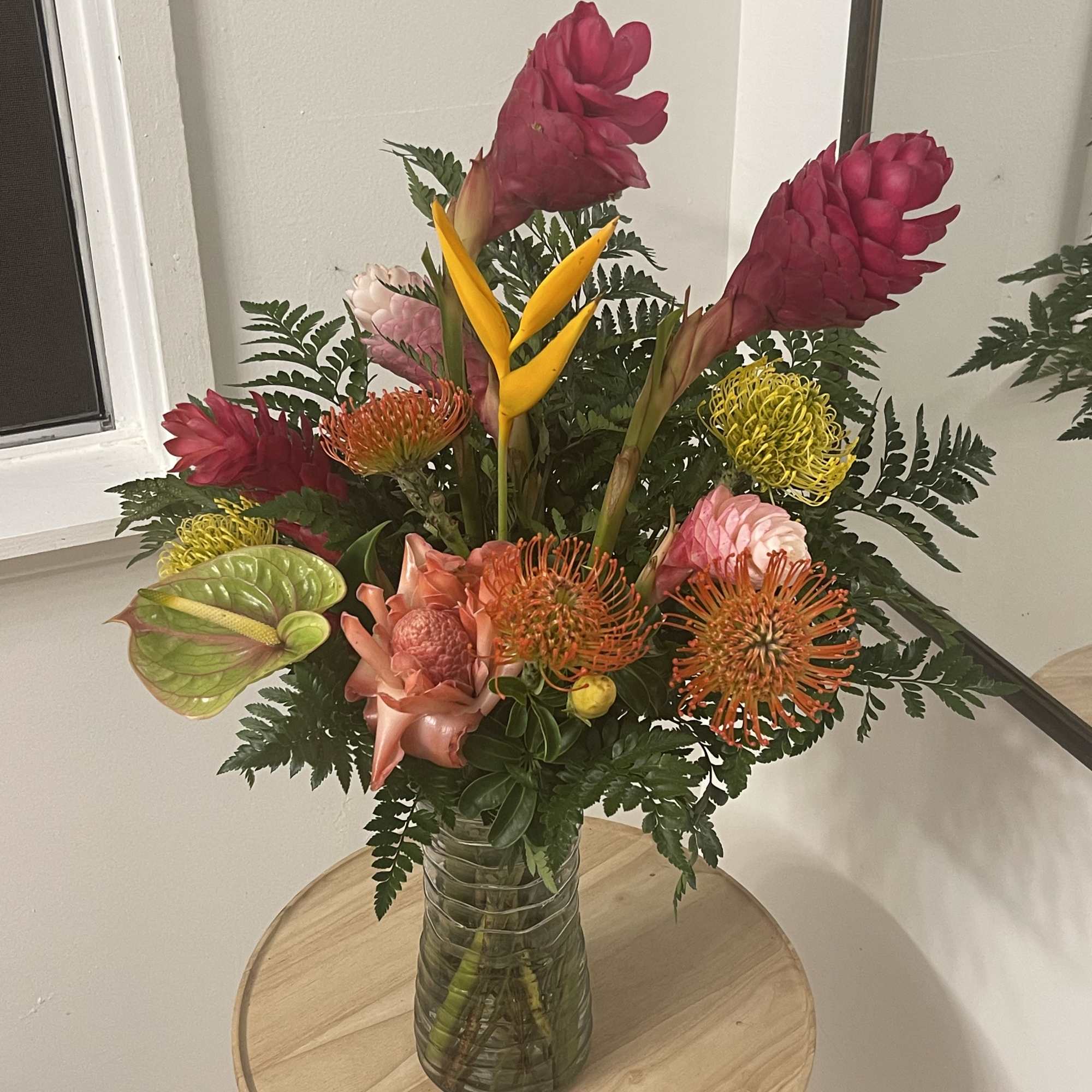 Exotic selection of Tropical Florals in a vase  this floral arrangement