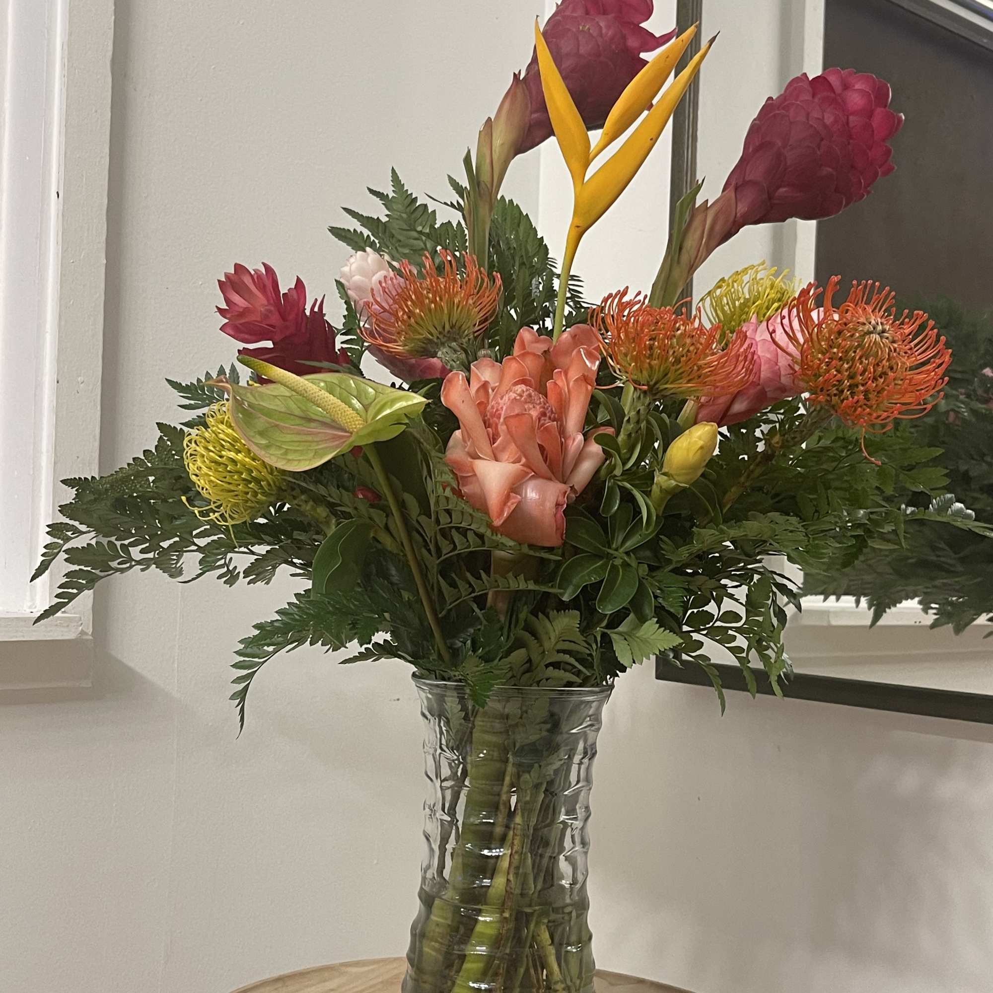 Exotic selection of Tropical Florals in a vase  this floral arrangement