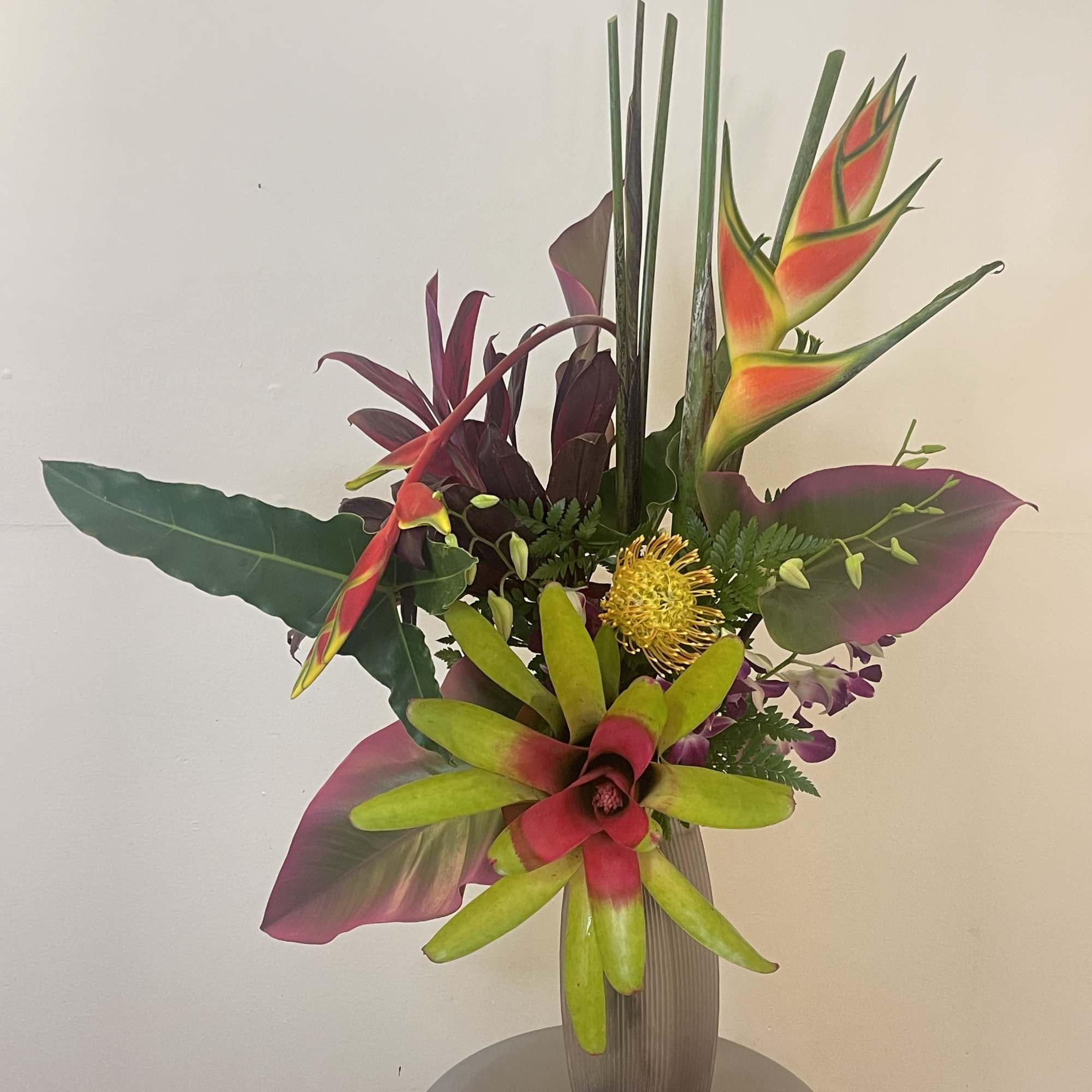 This tropical Zen arrangement will fascinate you with our exotic blooms 
