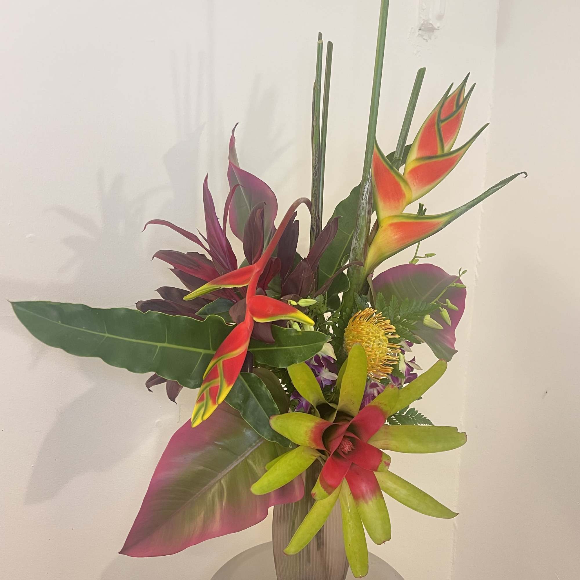 This tropical Zen arrangement will fascinate you with our exotic blooms 