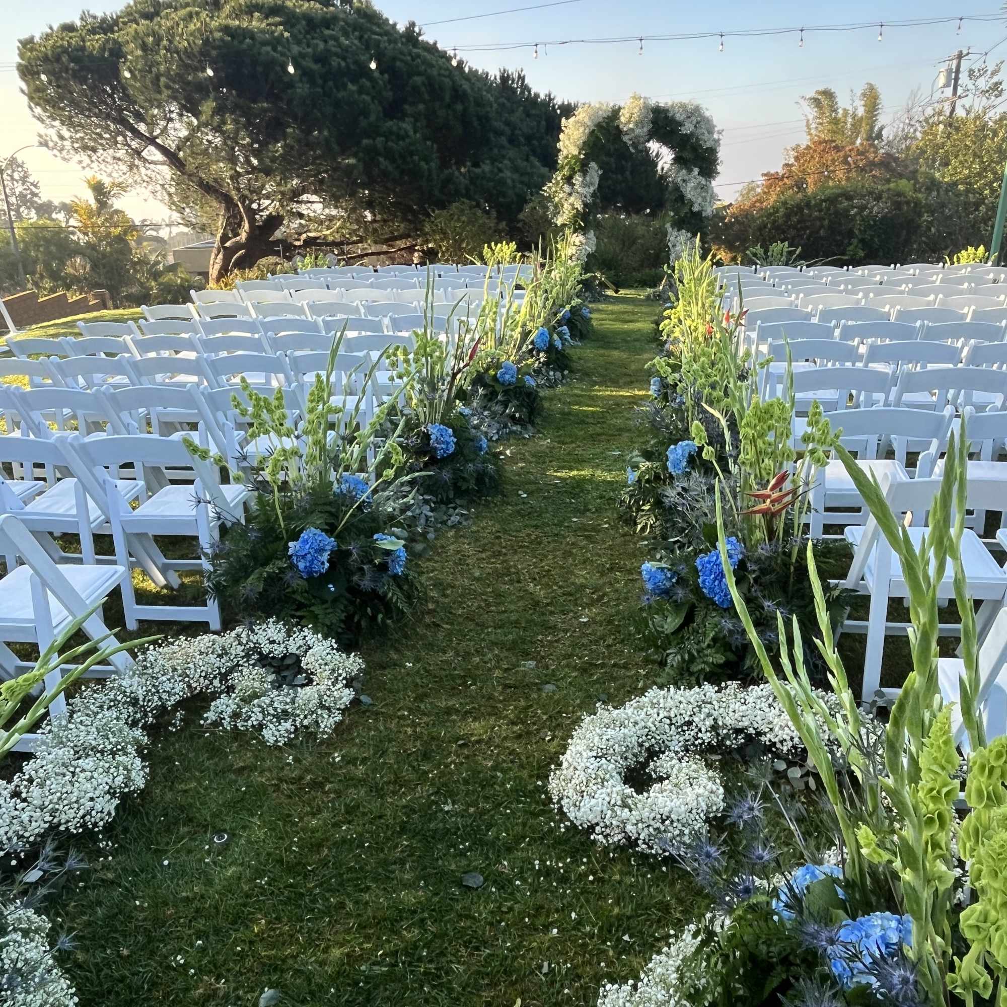 This wedding floral package includes florals down the aisle, a full flower