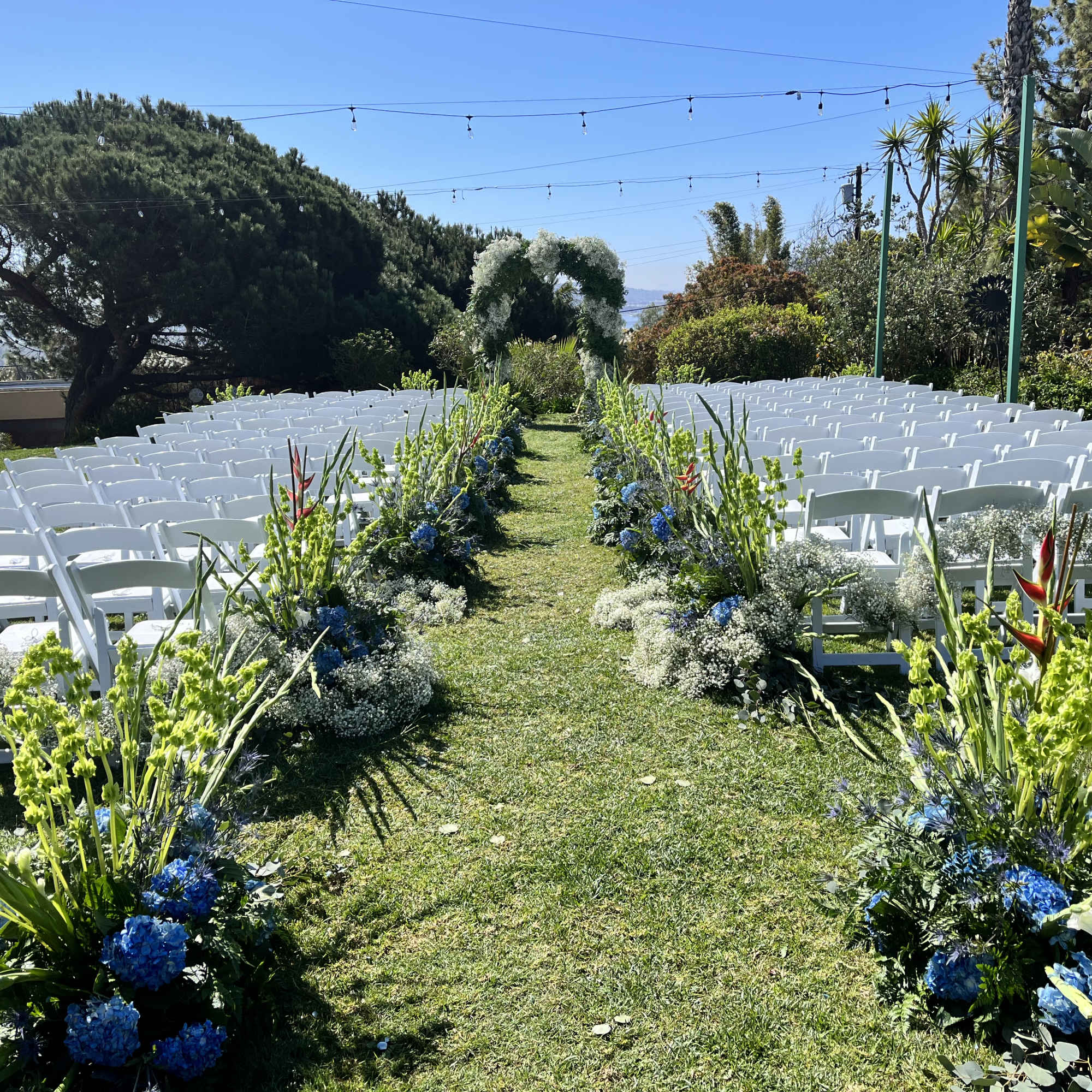 This wedding floral package includes florals down the aisle, a full flower