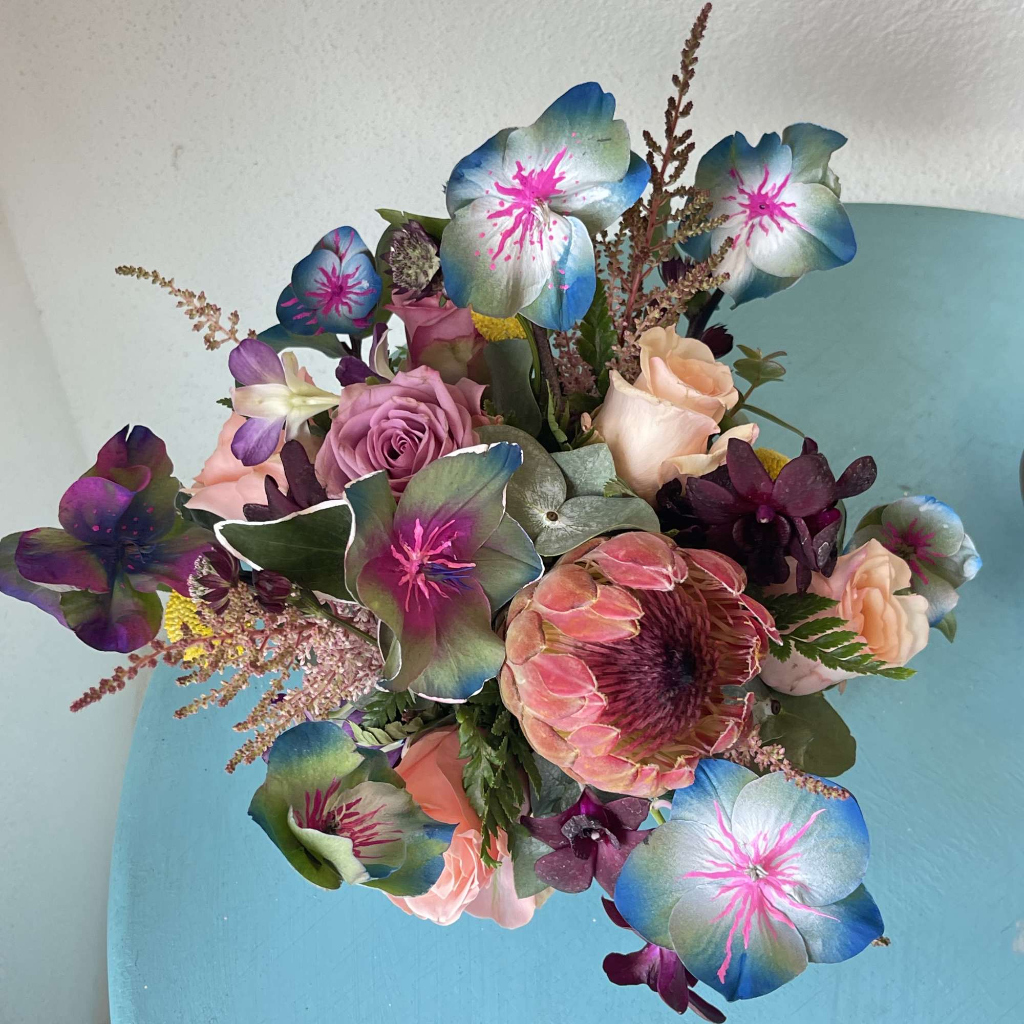 This impressive mix of hand painted foliage and florals Will take your