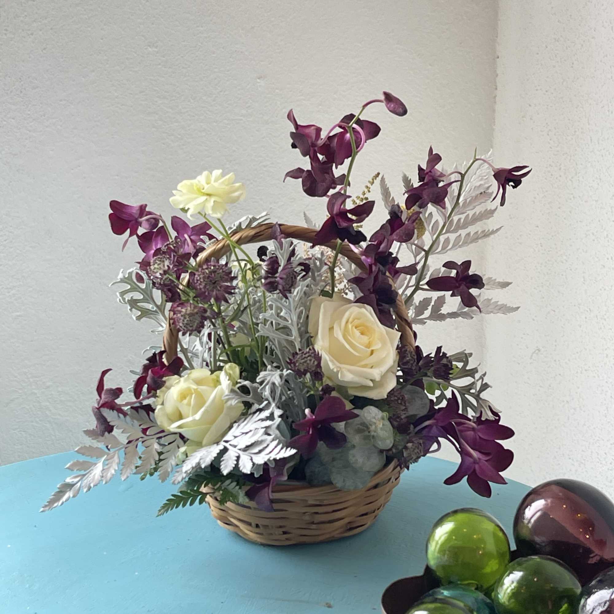 Dark purples, partnered with cream and white blooms. This exotic twist play