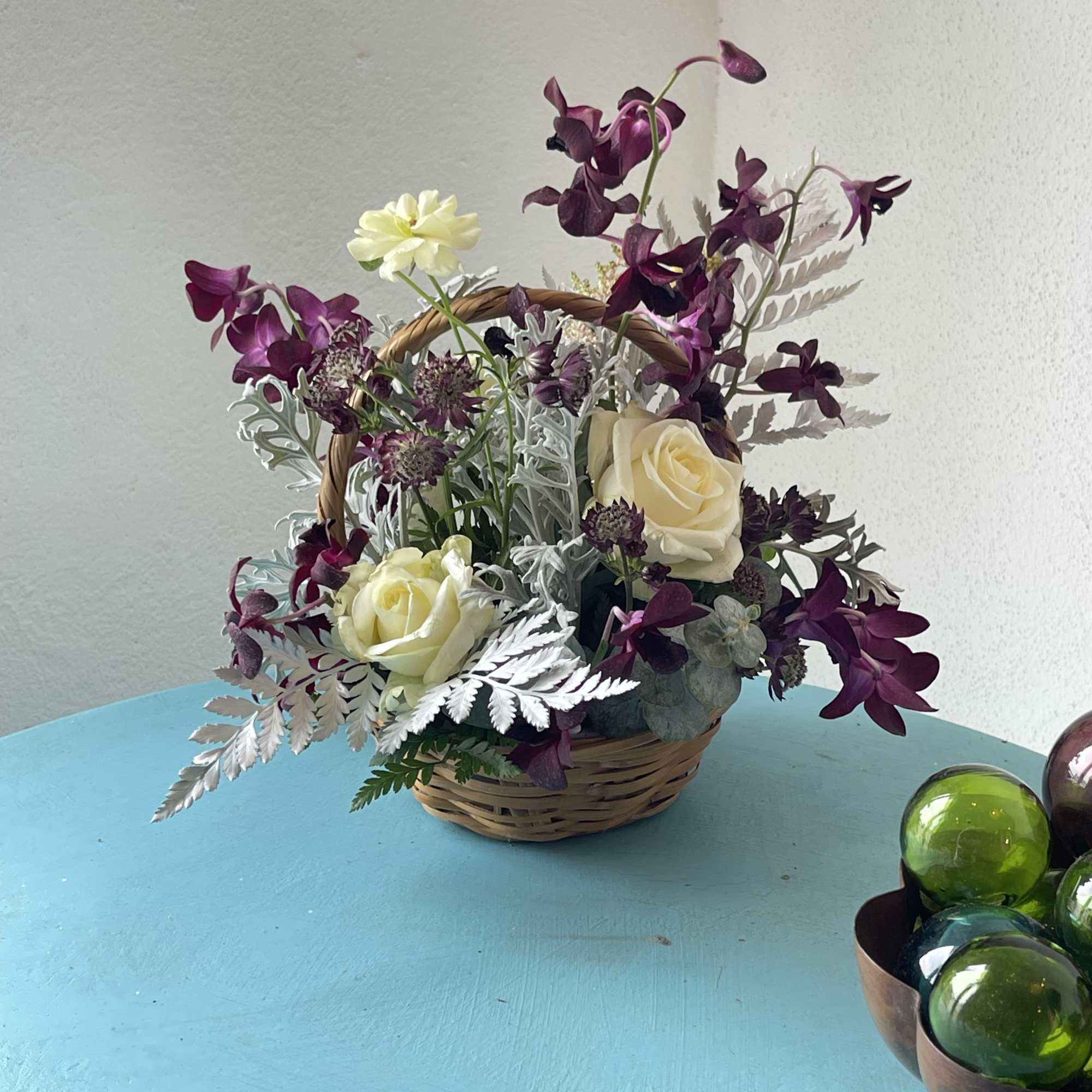 Dark purples, partnered with cream and white blooms. This exotic twist play