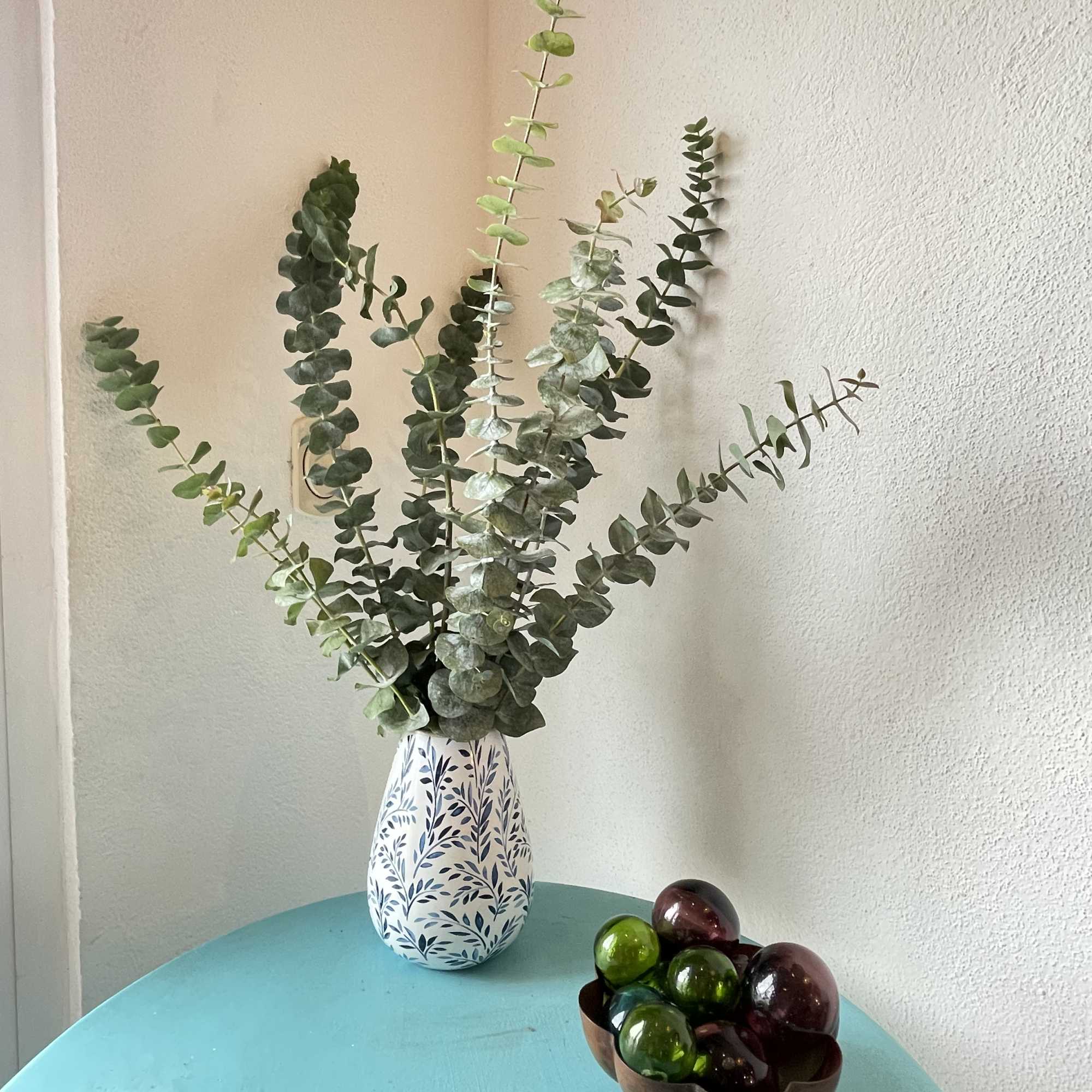 A large bunch of eucalyptus in a vase