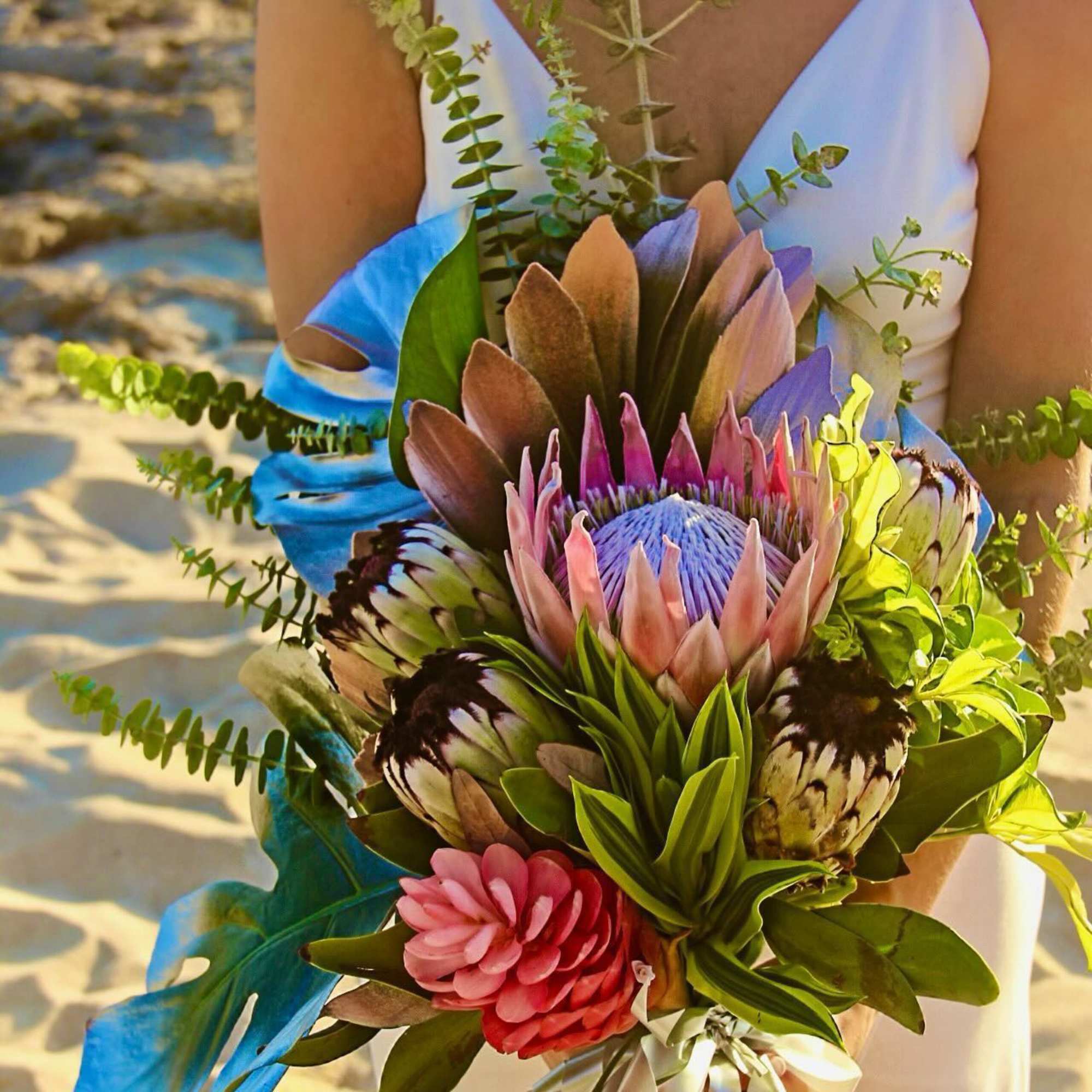 8 medium centerpiece style arrangements at $175 each
3 large sweetheart bouquets at