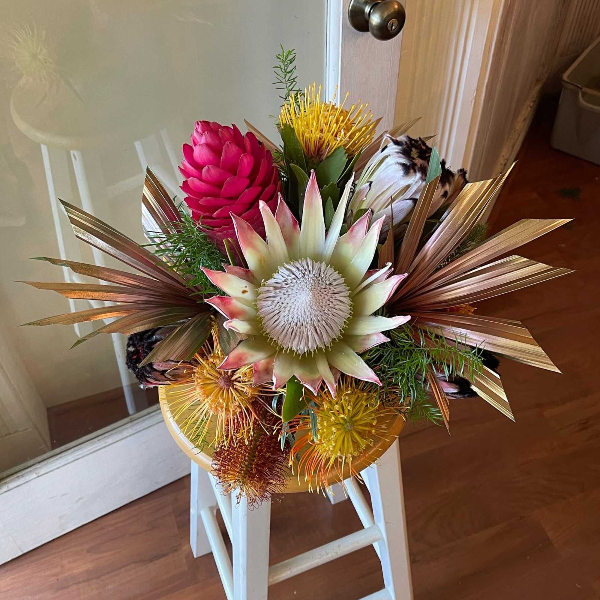 8 medium centerpiece style arrangements at $175 each
3 large sweetheart bouquets at