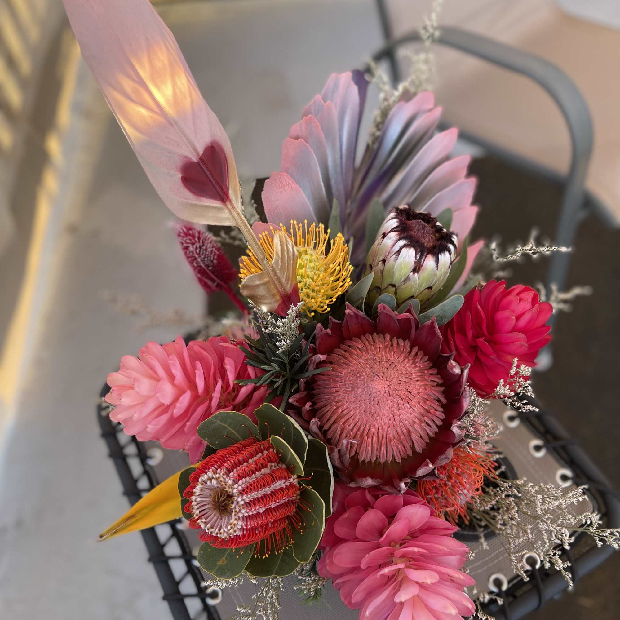 8 medium centerpiece style arrangements at $175 each
3 large sweetheart bouquets at
