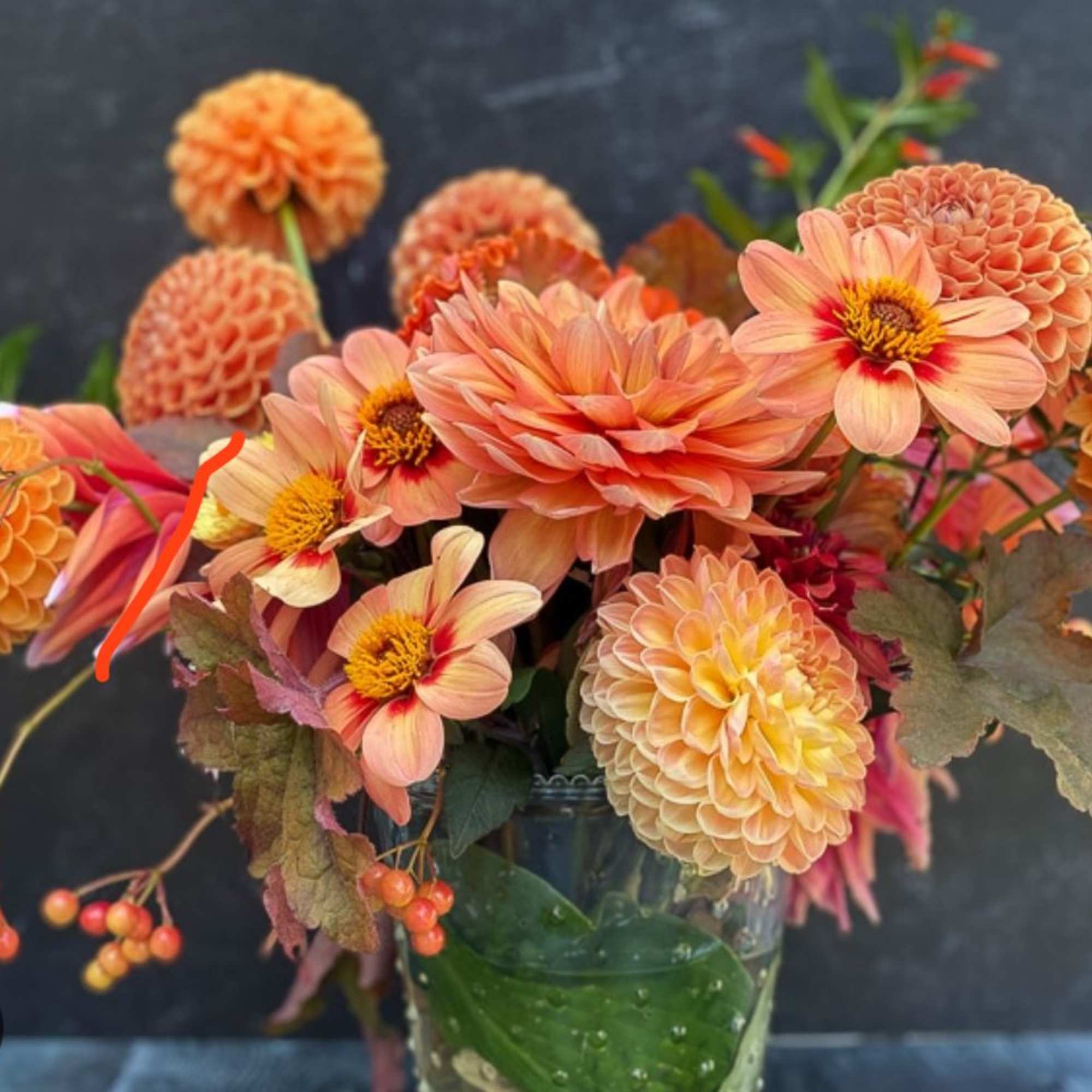 Two Small tropical bouquets and one ball arrangement with orange and fall