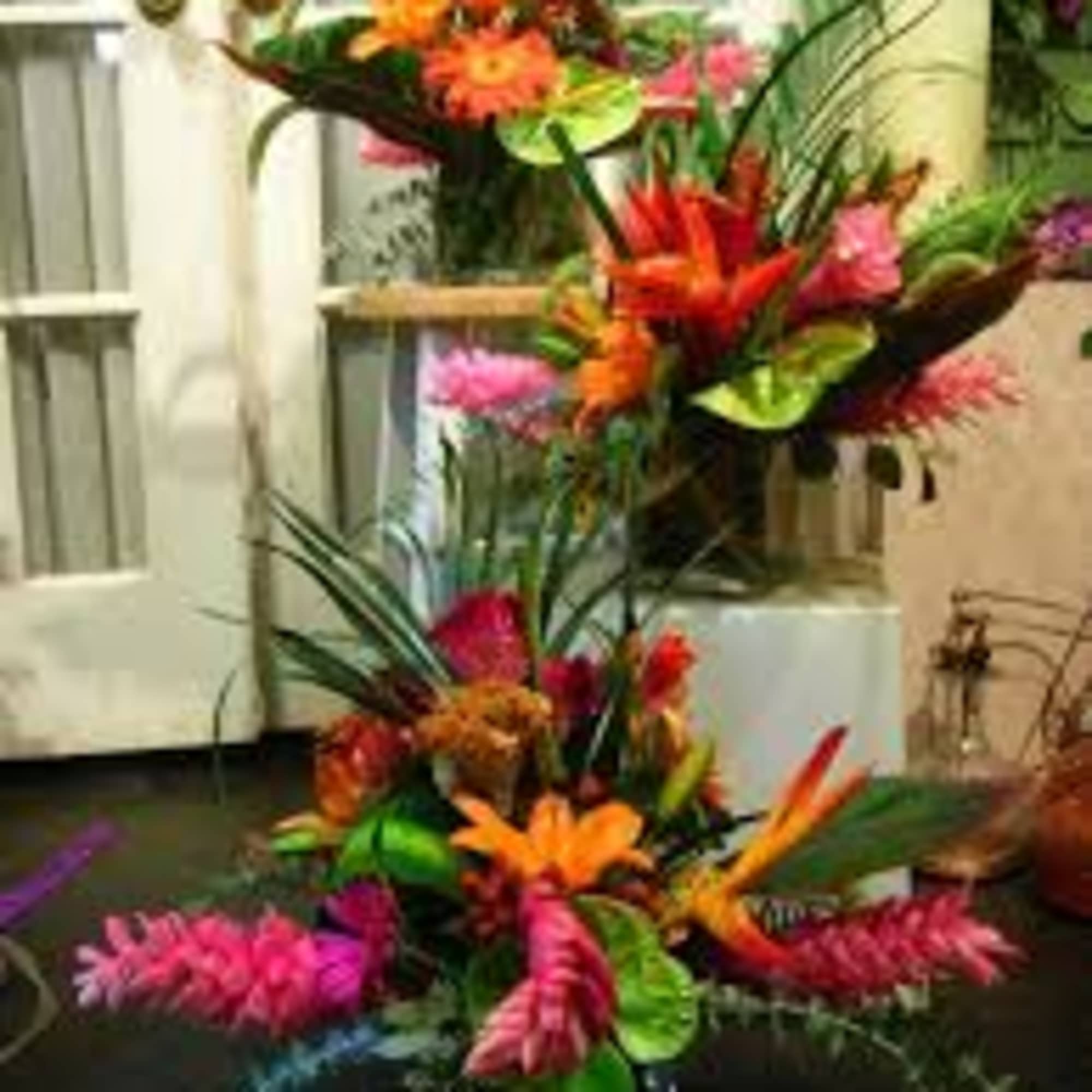 One  mixed tropical blooms and exotic foliage 