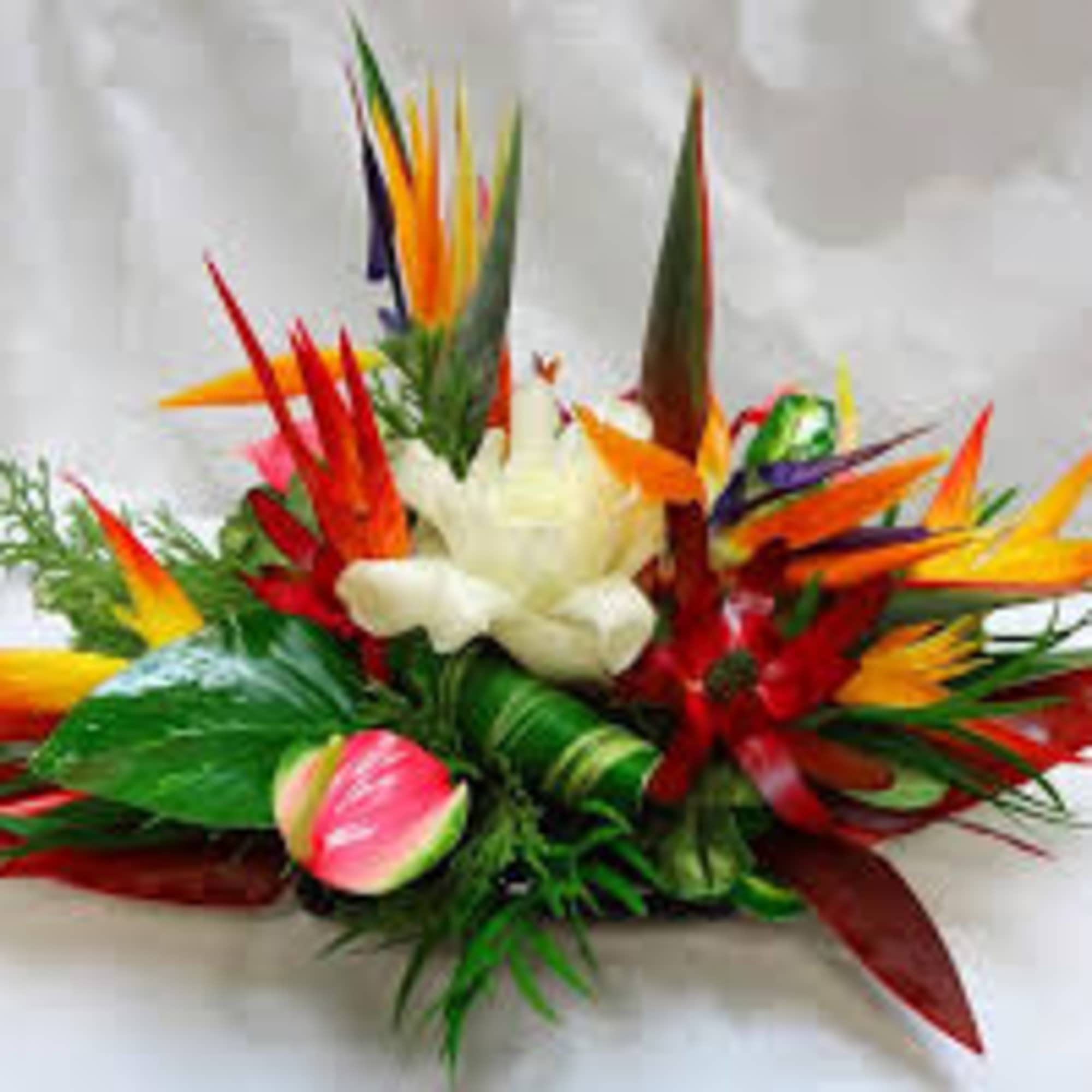 One  mixed tropical blooms and exotic foliage 