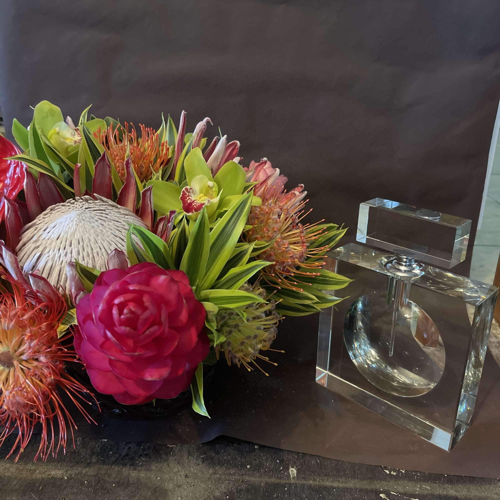 This fine exotic arrangement is paired with a luxury high quality crystal