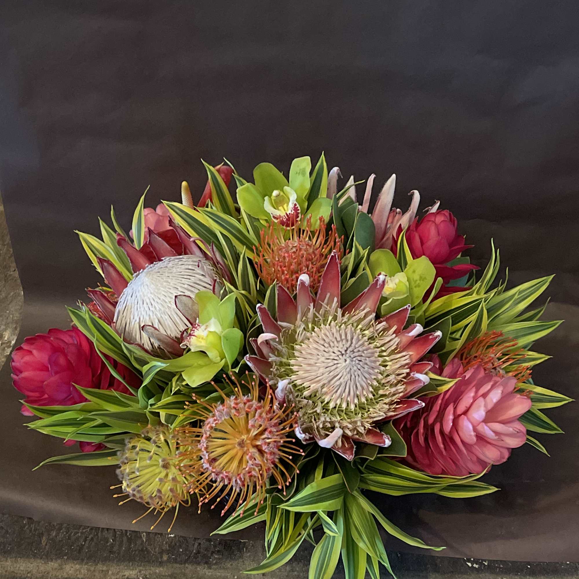 This fine exotic arrangement is paired with a luxury high quality crystal