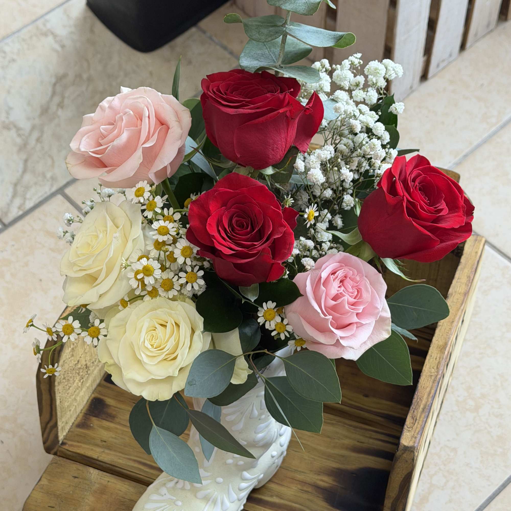 Red and rosy charm makes this Mother's Day bouquet feel like a
