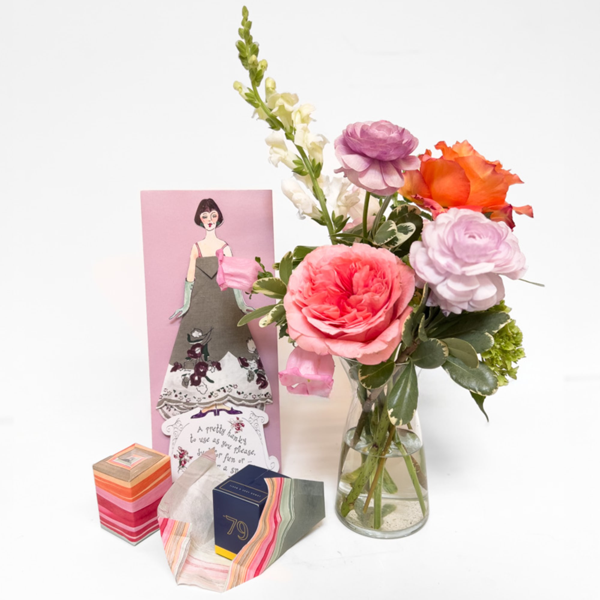 A soft, seasonal palette of summer blooms is paired with two surprise