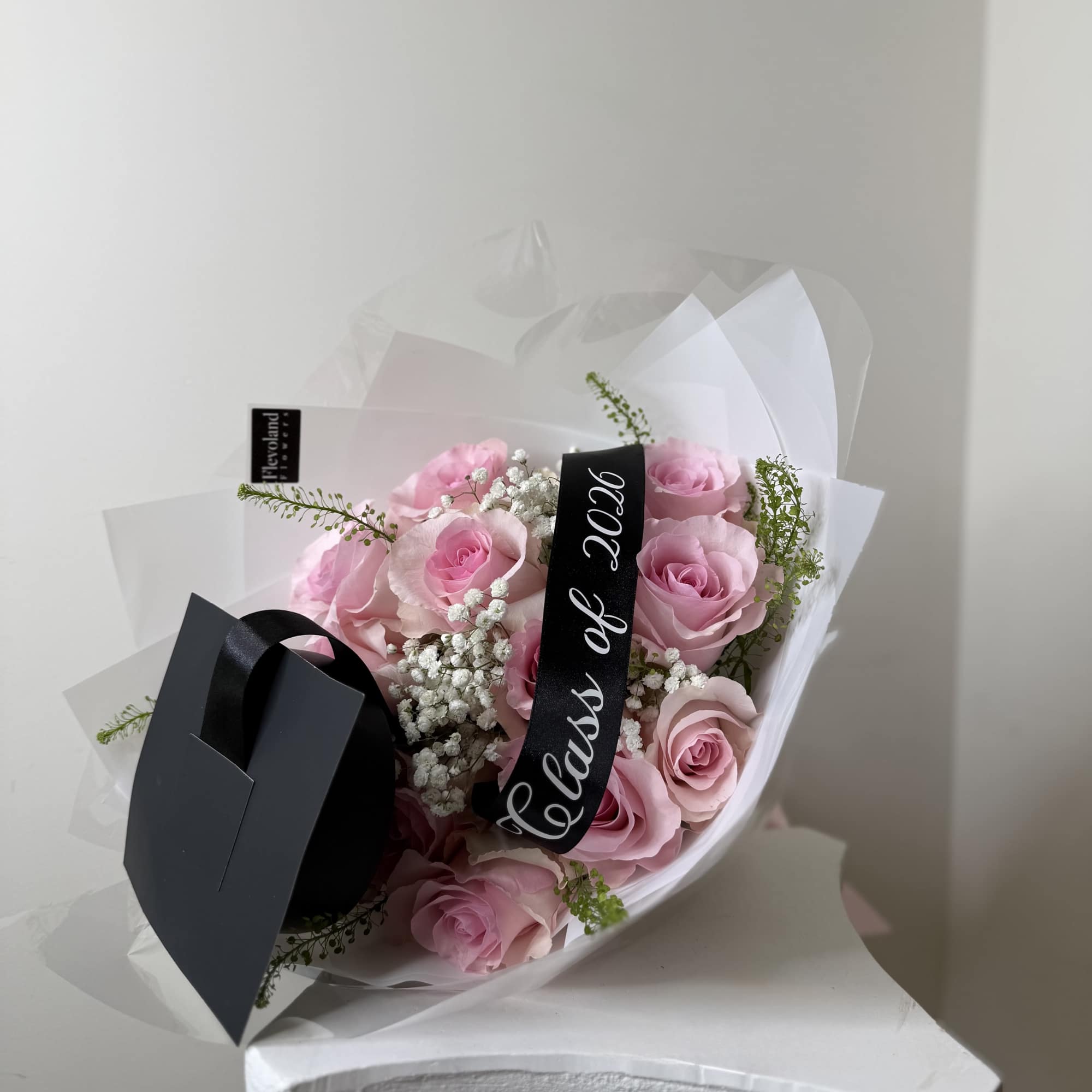 A full blush rose bouquet designed with soft pink roses, baby&rsquo;s breath