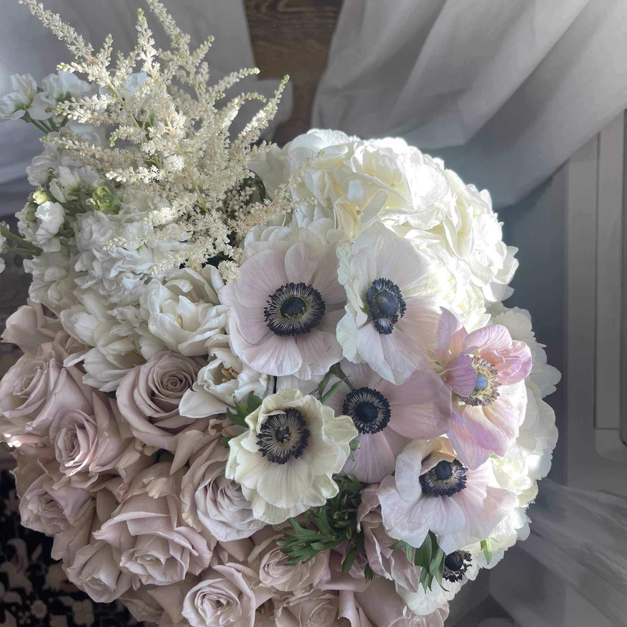 This stunning piece has 24  stunning roses, anemones, hydrangeas, tulips and