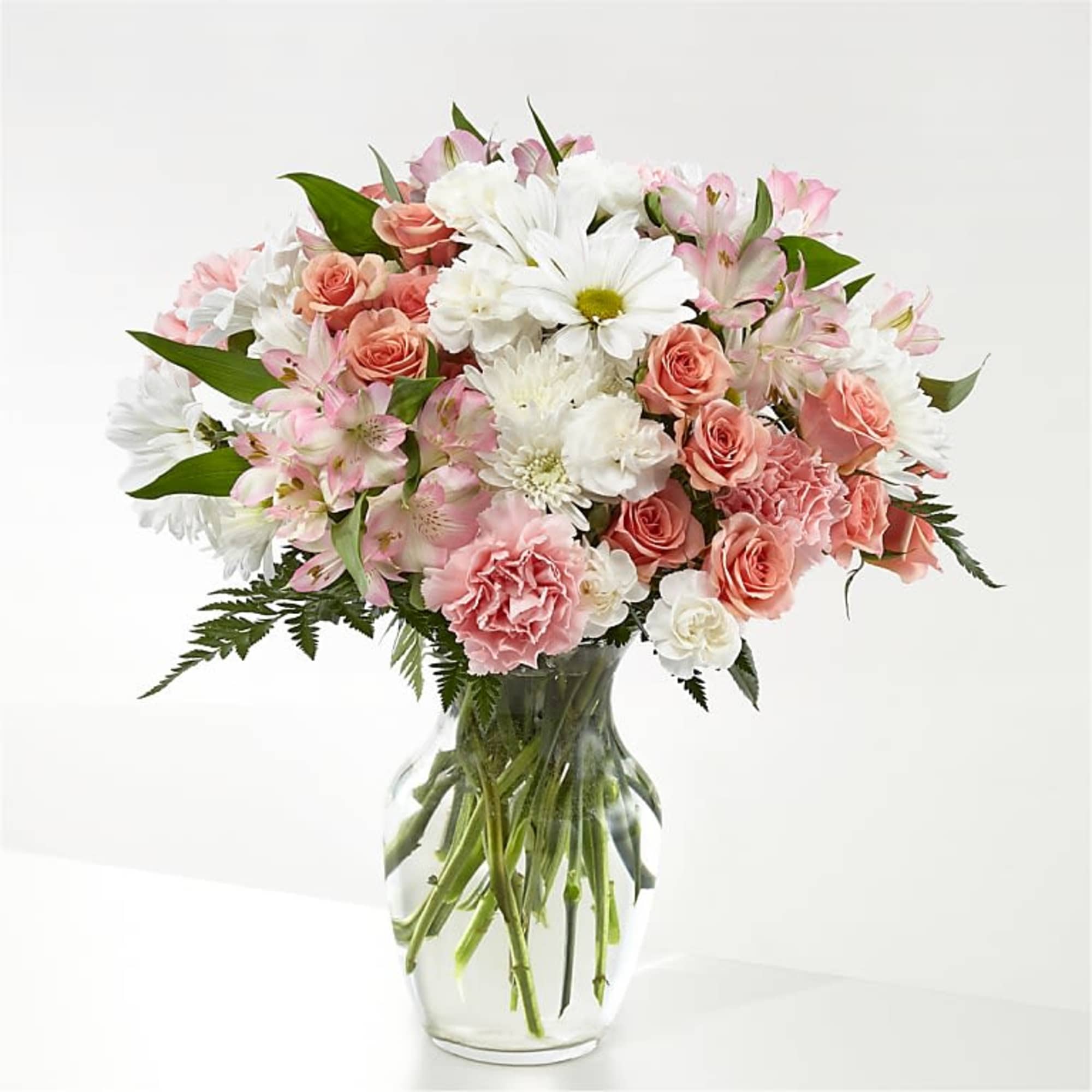A soft, romantic bouquet in gentle pinks and whites-Sweet Peach Serenade is
