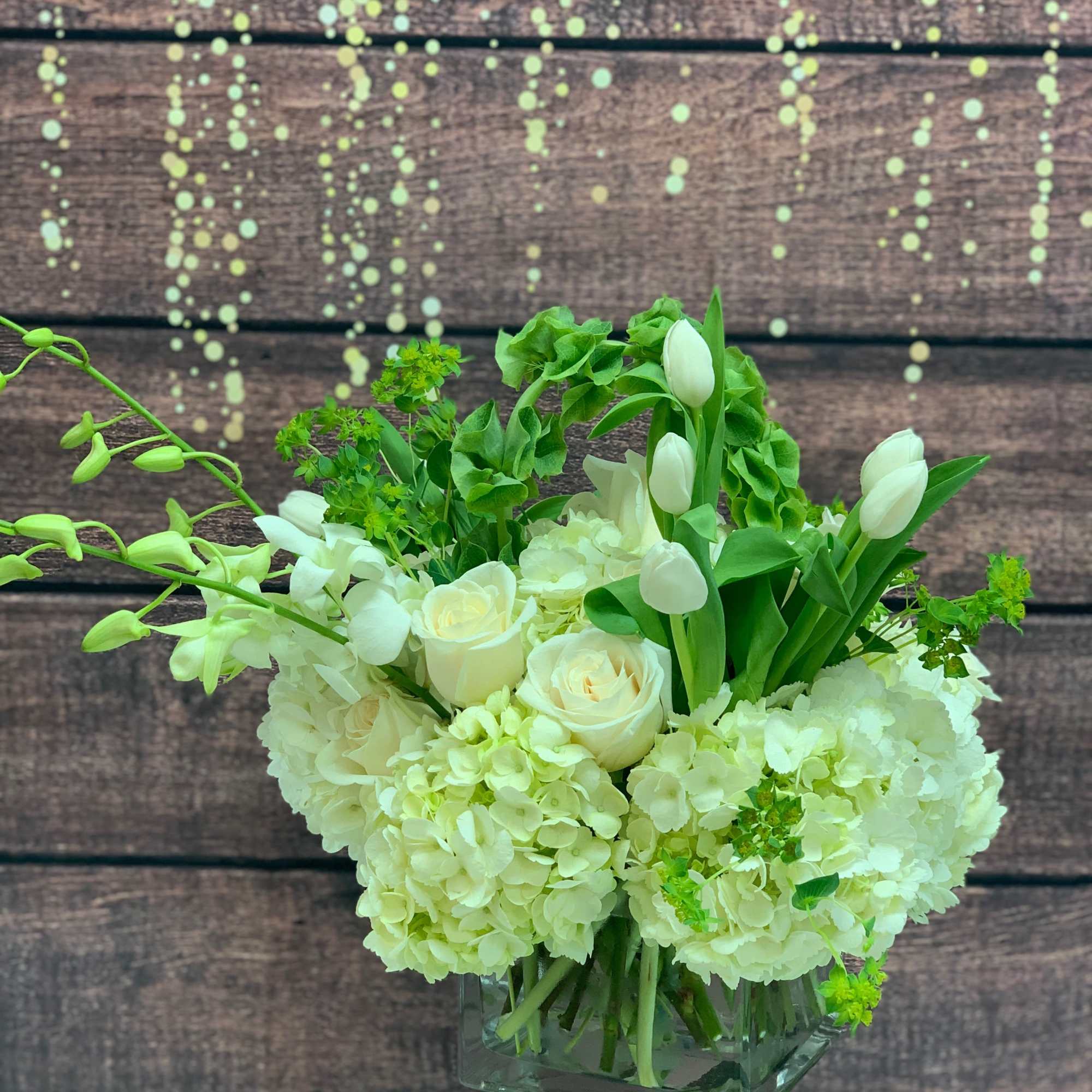 An XL mix of jumbo hydrangea, roses,  tulips, orchids, and our